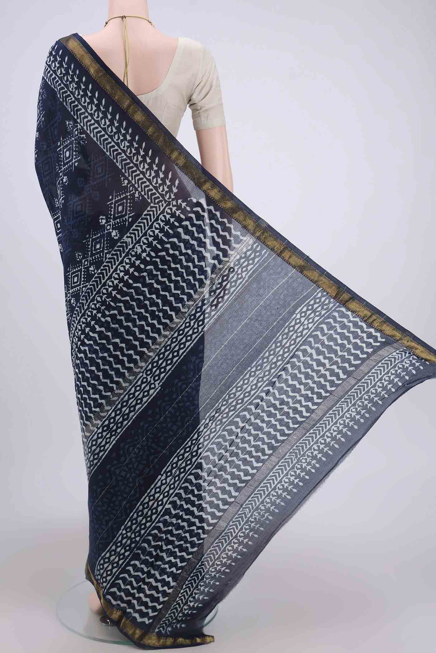 Flat view of Indigo Maheshwari Silk Cotton Saree with Printed design on the body and Zari Border. 