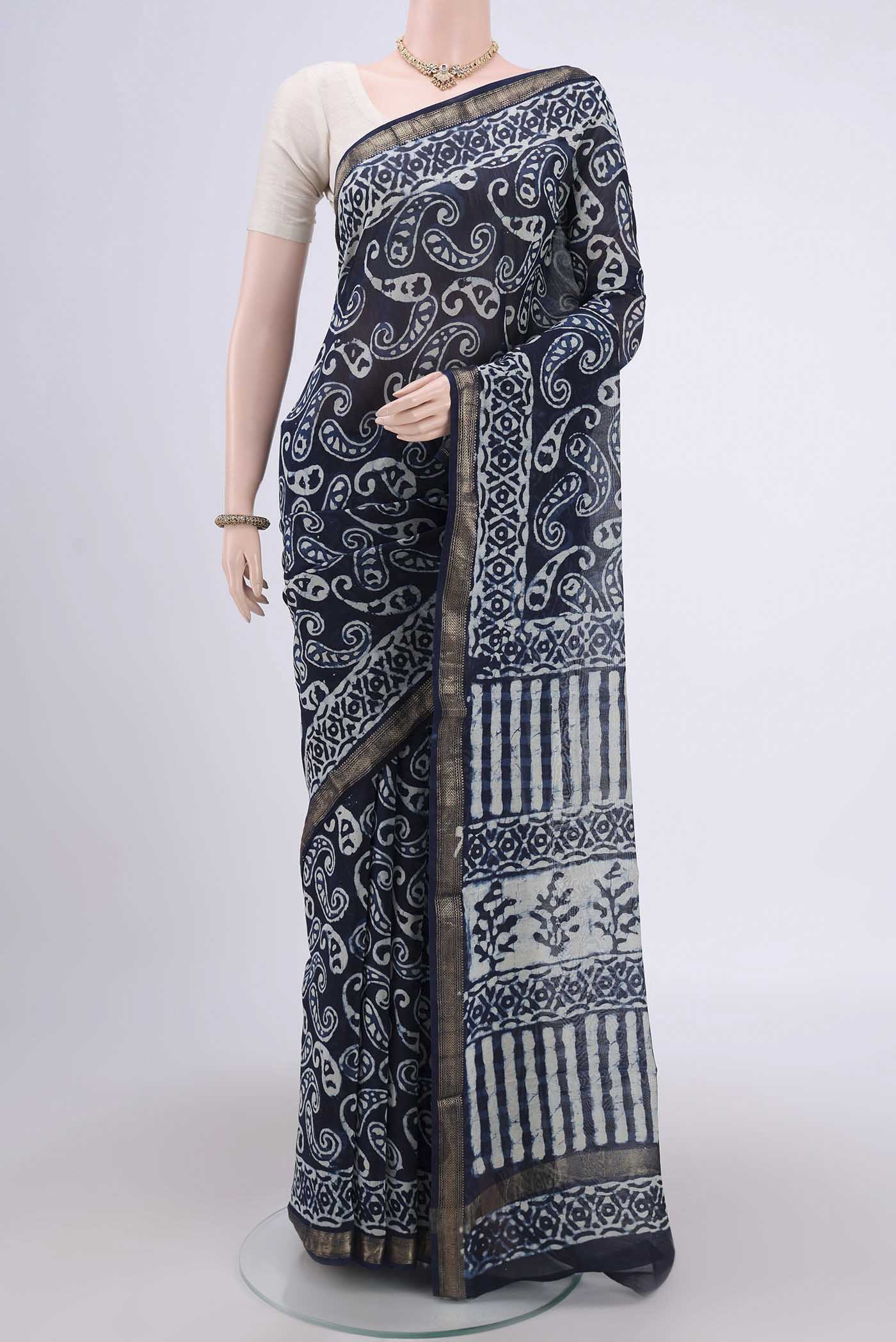 Indigo Maheshwari Silk Cotton Saree with Printed design on the body and Zari Border.  displayed on a mannequin