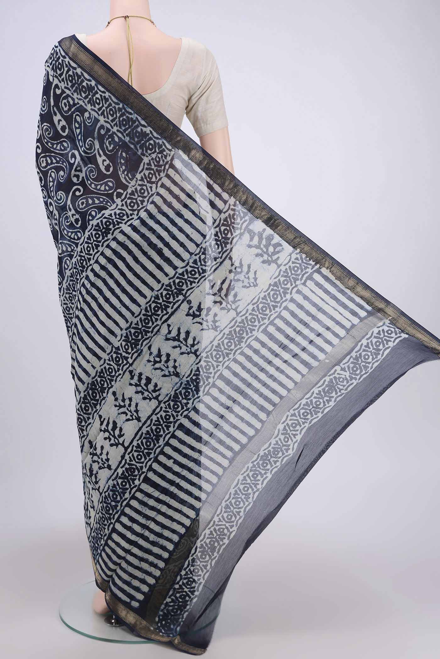 Flat view of Indigo Maheshwari Silk Cotton Saree with Printed design on the body and Zari Border. 