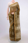Mehandi Green Maheshwari Silk Cotton Saree with Printed design on the body and Zari Border.  displayed on a mannequin