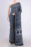 Indigo Maheshwari Silk Cotton Saree with Batik Print on the body and Zari Border.  displayed on a mannequin