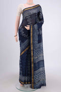 Indigo Maheshwari Silk Cotton Saree with Batik Print on the body and Zari Border.  displayed on a mannequin