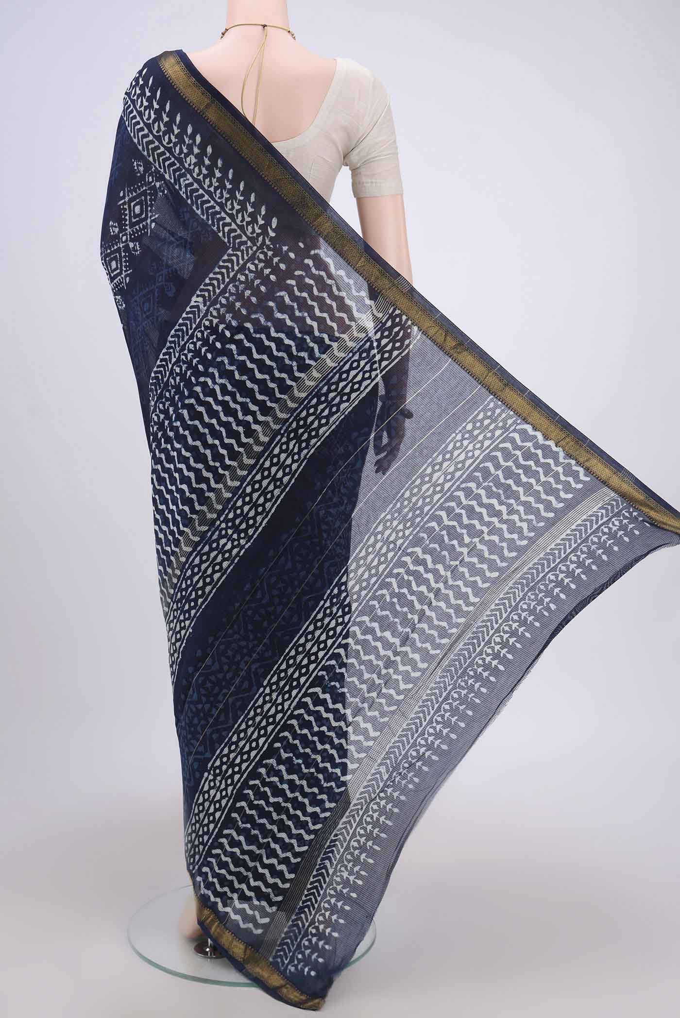 Flat view of Indigo Maheshwari Silk Cotton Saree with Batik Print on the body and Zari Border. 