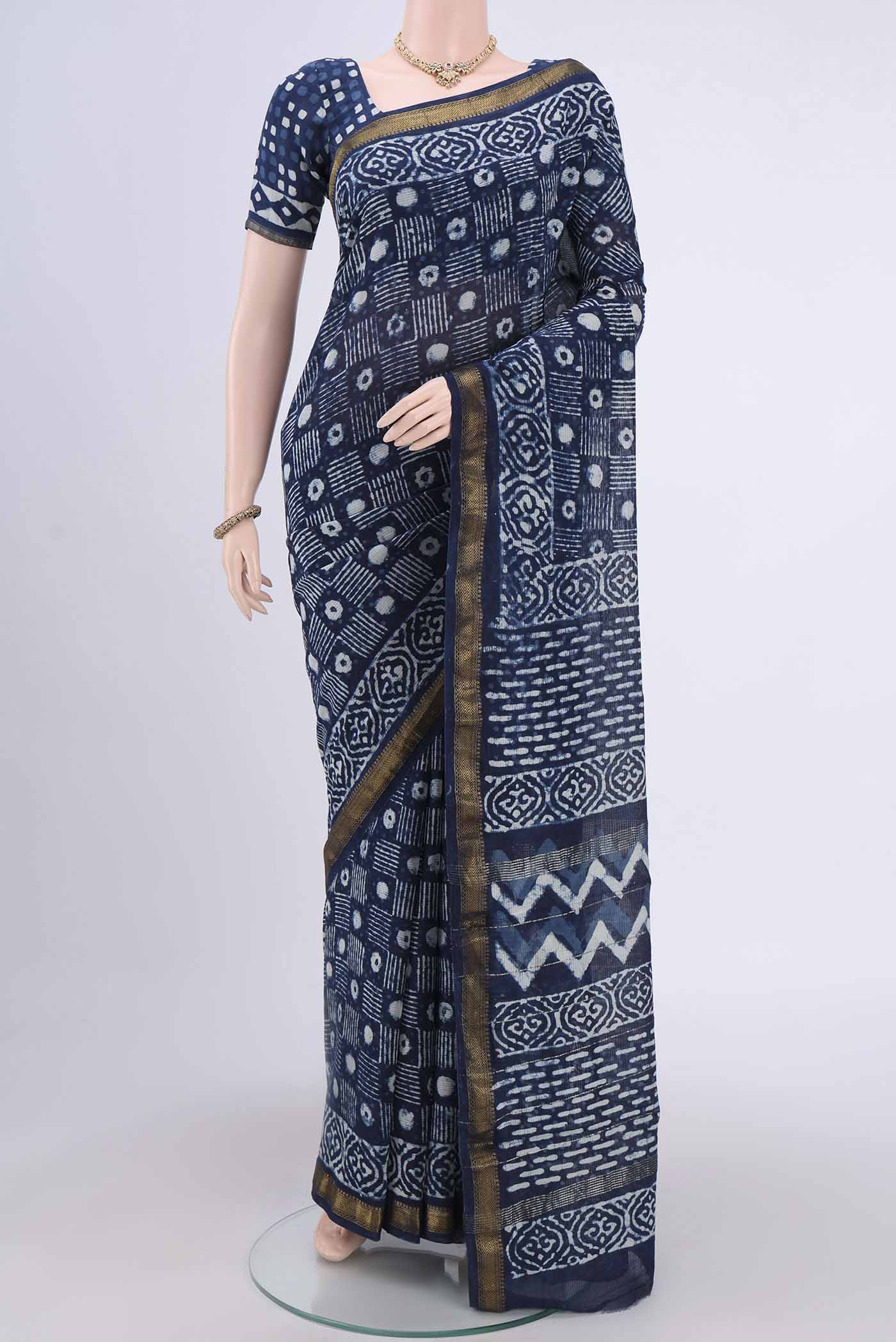 Indigo Maheshwari Silk Cotton Saree with Printed design on the body and Zari Border.  displayed on a mannequin