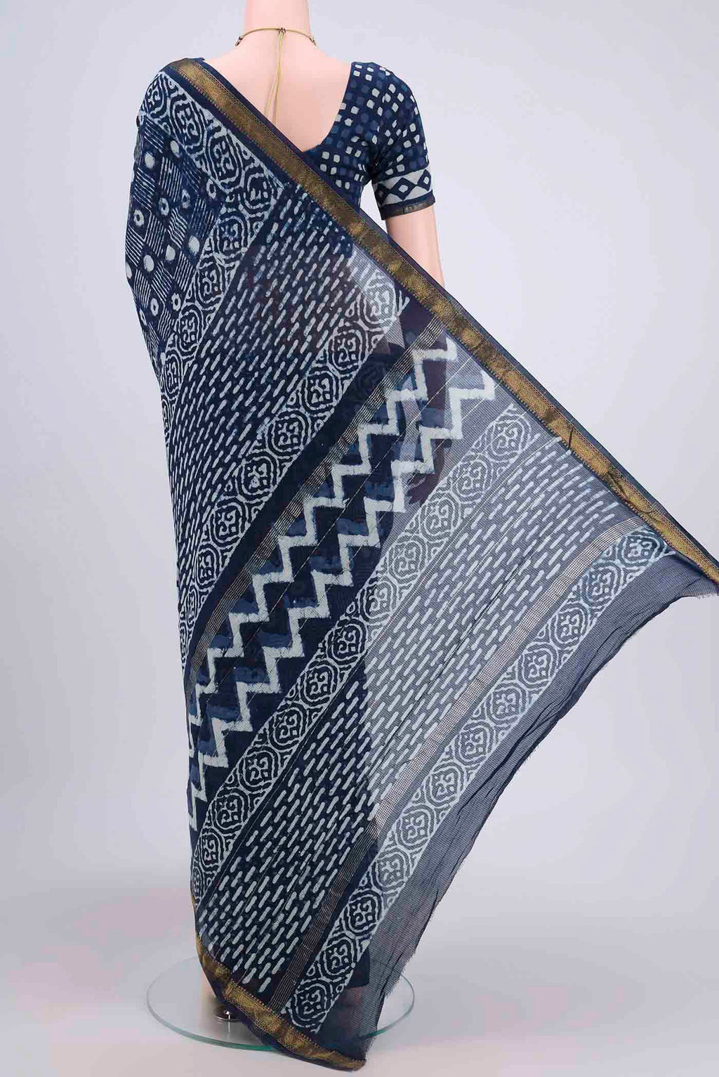 Flat view of Indigo Maheshwari Silk Cotton Saree with Printed design on the body and Zari Border. 