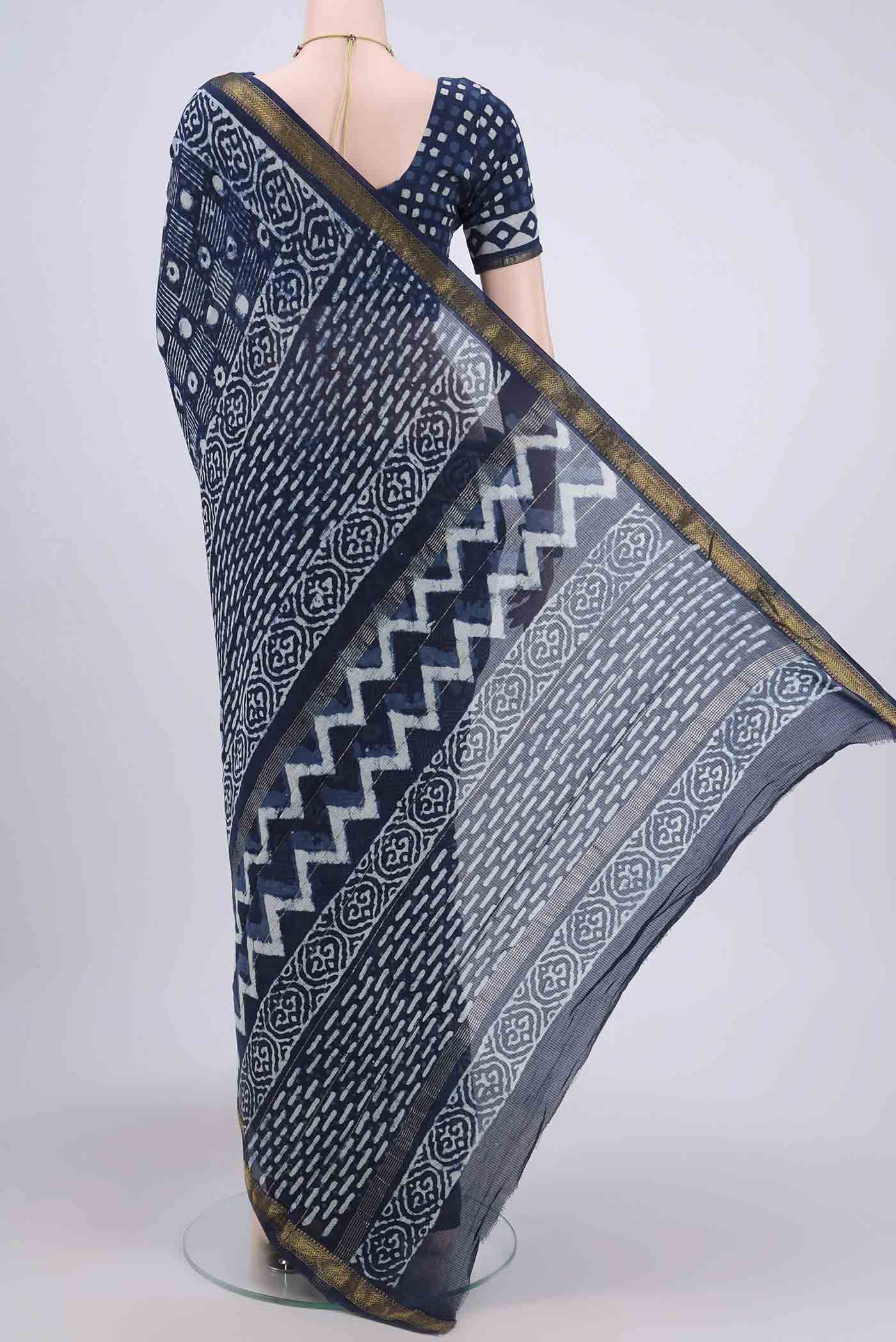 Flat view of Indigo Maheshwari Silk Cotton Saree with Printed design on the body and Zari Border. 