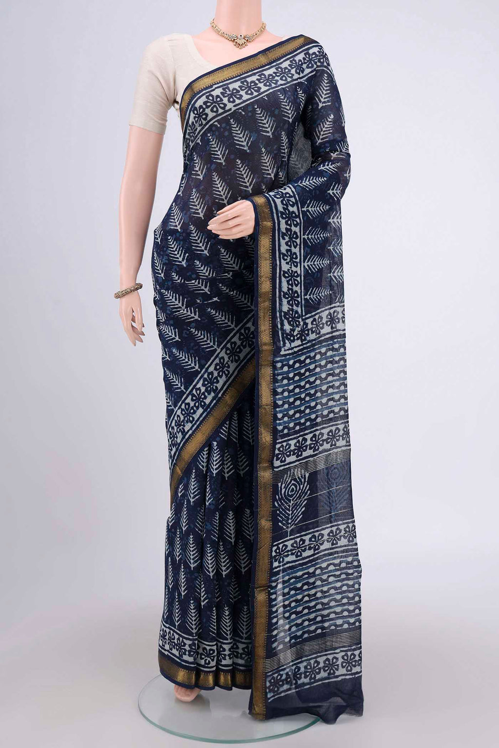 Indigo Maheshwari Silk Cotton Saree with Printed design on the body and Zari Border.  displayed on a mannequin