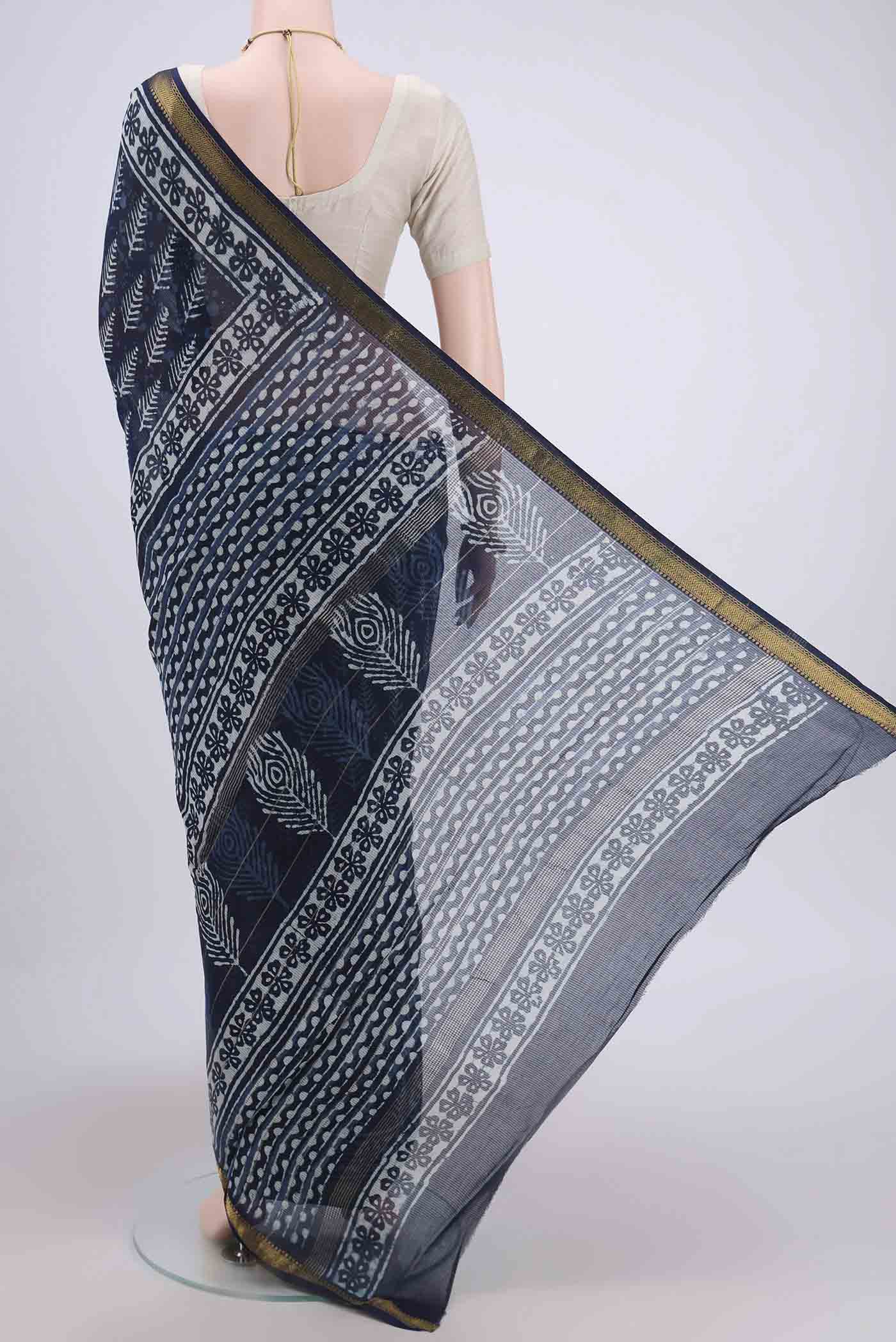 Flat view of Indigo Maheshwari Silk Cotton Saree with Printed design on the body and Zari Border. 