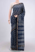 Indigo Maheshwari Silk Cotton Saree with Batik Print on the body and Zari Border.  displayed on a mannequin