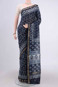 Indigo Maheshwari Silk Cotton Saree with Batik Print on the body and Zari Border.  displayed on a mannequin