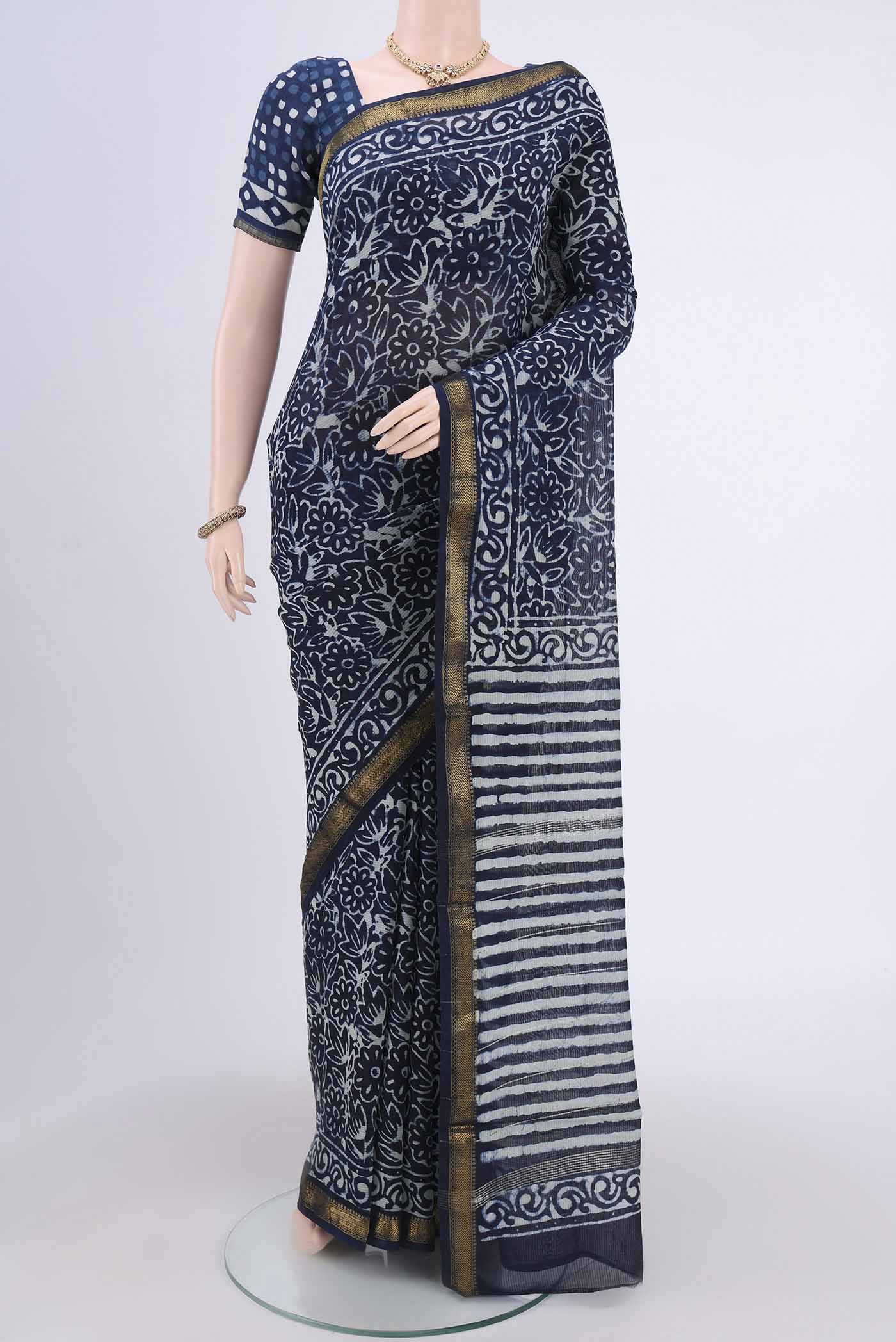 Indigo Maheshwari Silk Cotton Saree with Printed design on the body and Zari Border.  displayed on a mannequin