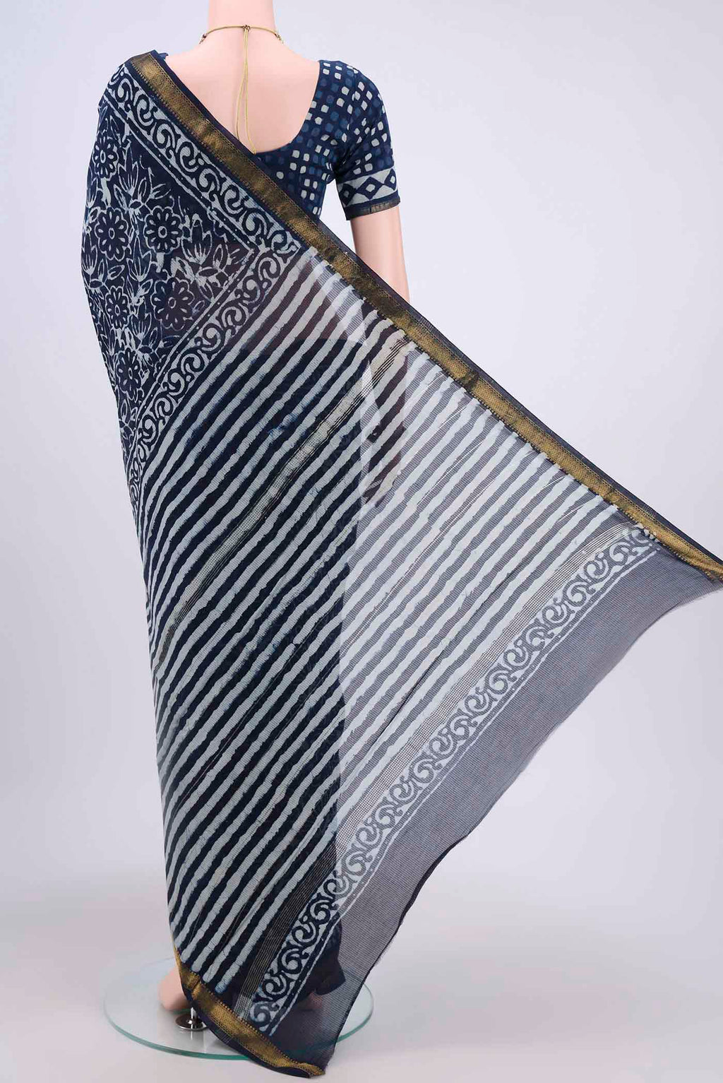 Flat view of Indigo Maheshwari Silk Cotton Saree with Printed design on the body and Zari Border. 