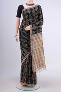 Black Tussar Silk Saree with Printed design on the body and Plain Border.  displayed on a mannequin