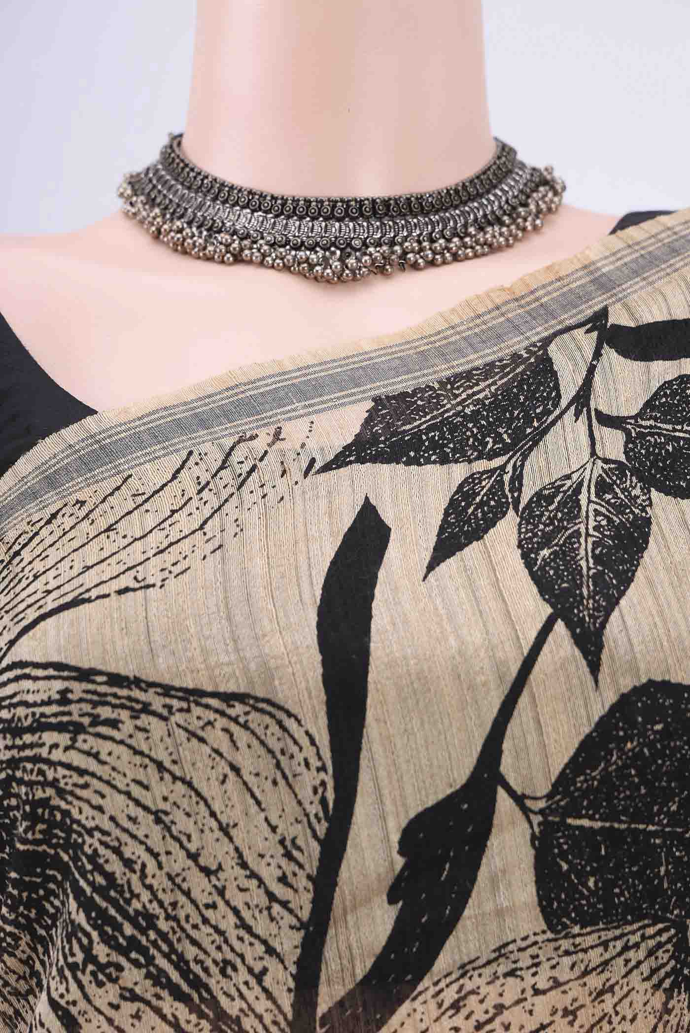 Border image of Dark Beige Tussar Silk Saree with Printed design on the body and Plain Border. 