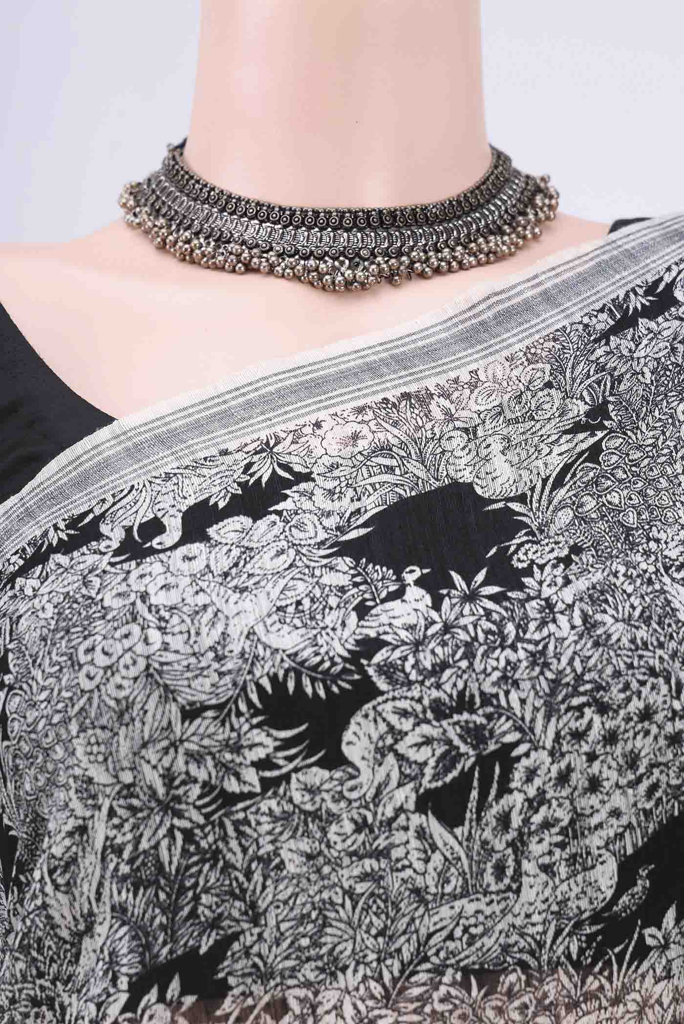 Border image of Black Tussar Silk Saree with Printed design on the body and Plain Border. 