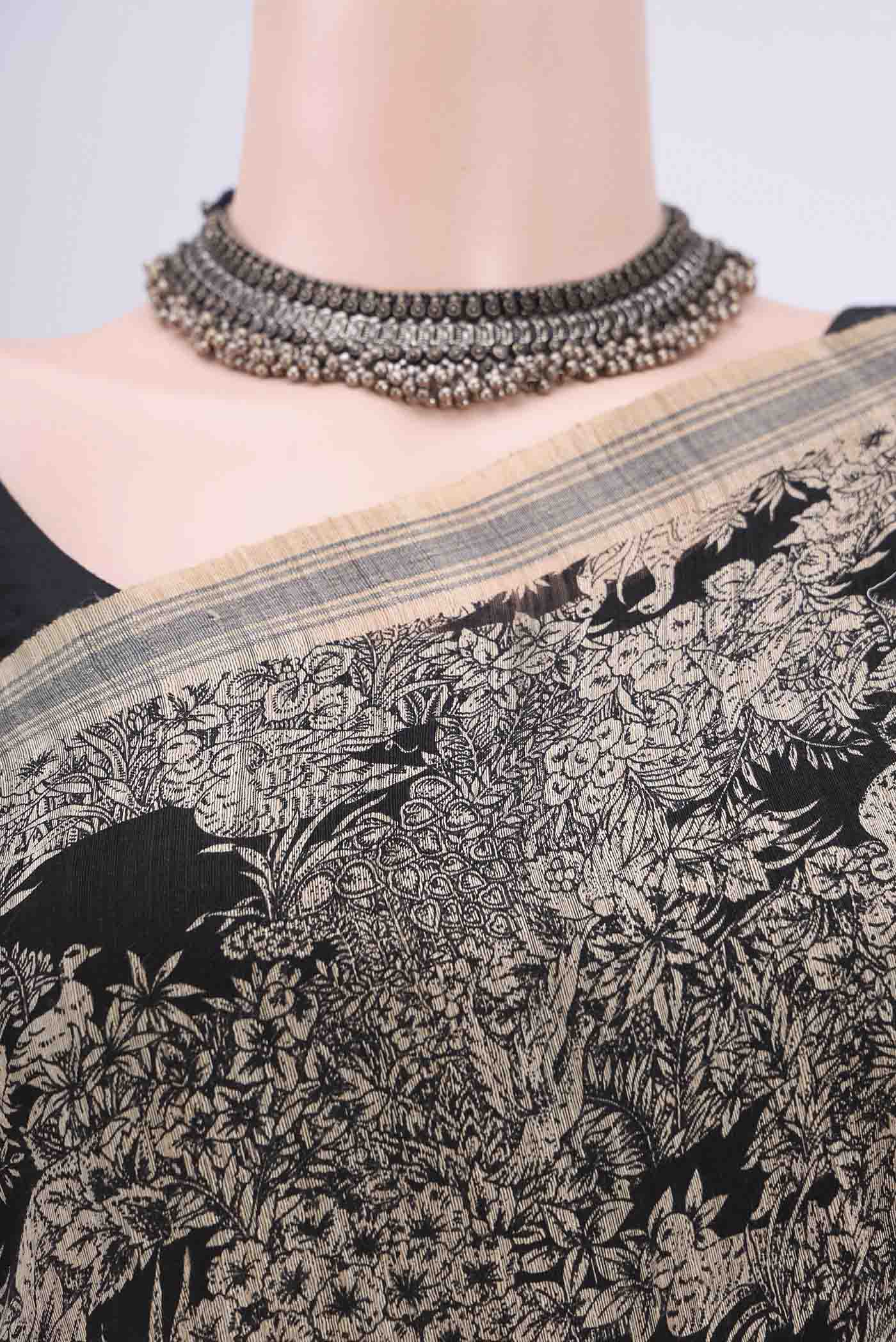 Border image of Black Tussar Silk Saree with Printed design on the body and Plain Border. 