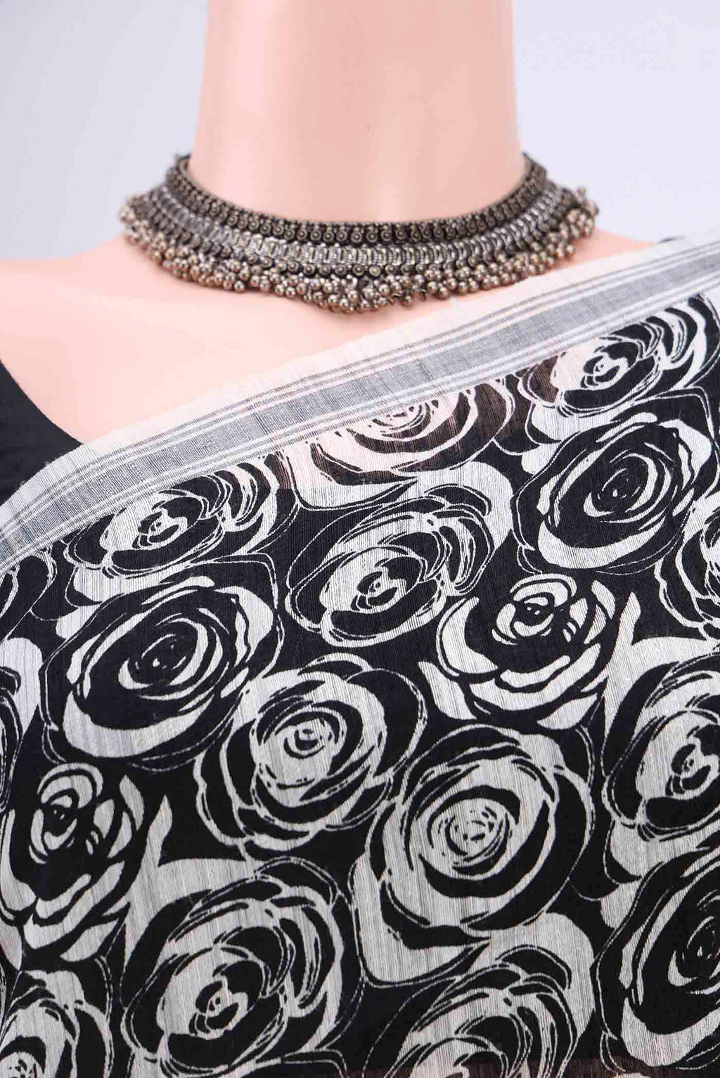 Border image of Black Tussar Silk Saree with Printed design on the body and Plain Border. 