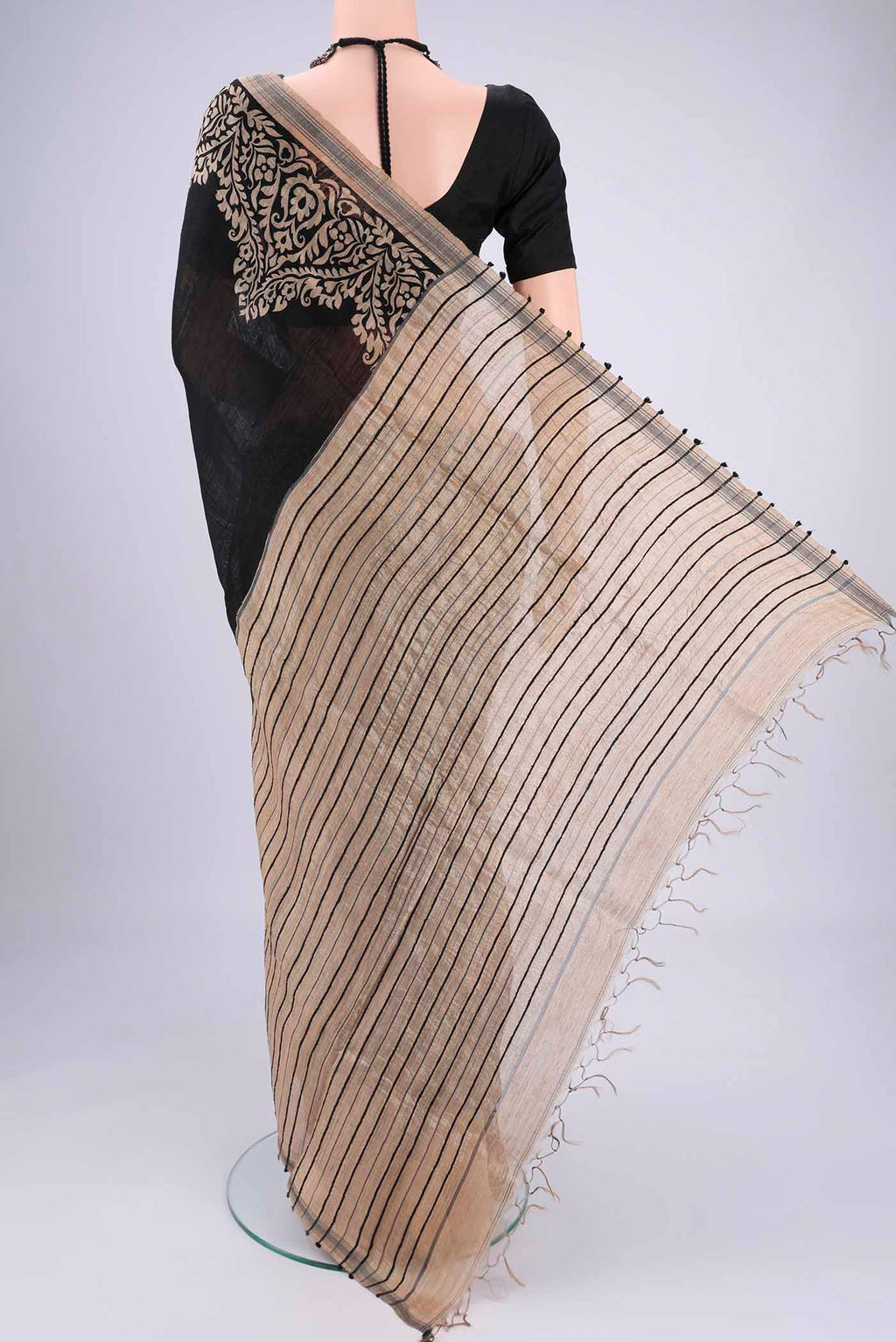 Flat view of Black Tussar Silk Saree with Plain Body and Plain Border. 