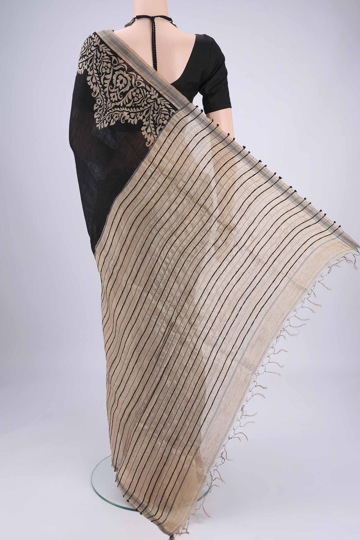 Flat view of Black Tussar Silk Saree with Plain Body and Plain Border. 