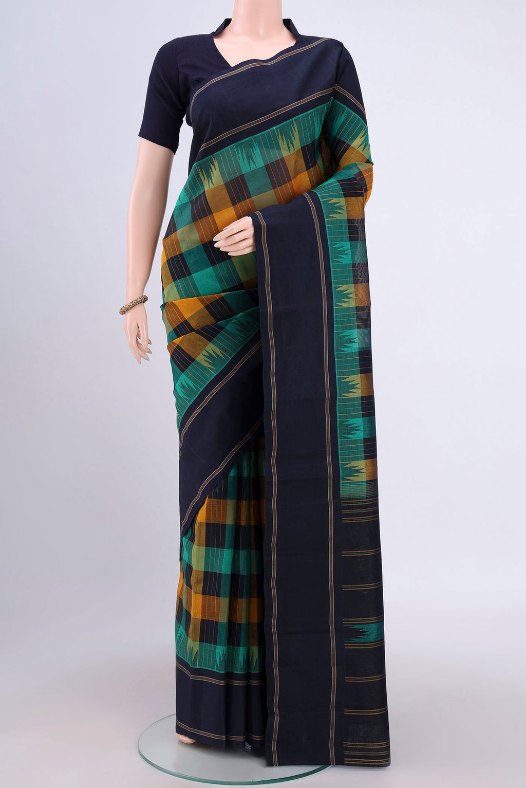 Multi Color Kanchi Cotton Saree with Checked design on the body and Thread Border.  displayed on a mannequin