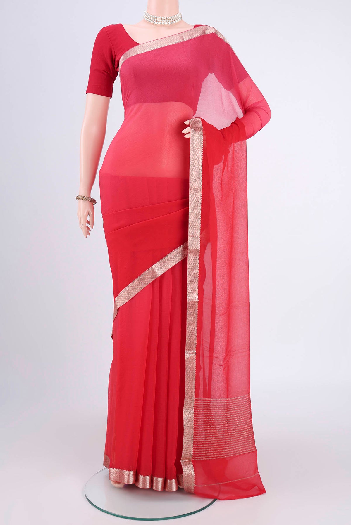 Red Mysore Chiffon Saree with Plain Body and Zari Border.  displayed on a mannequin