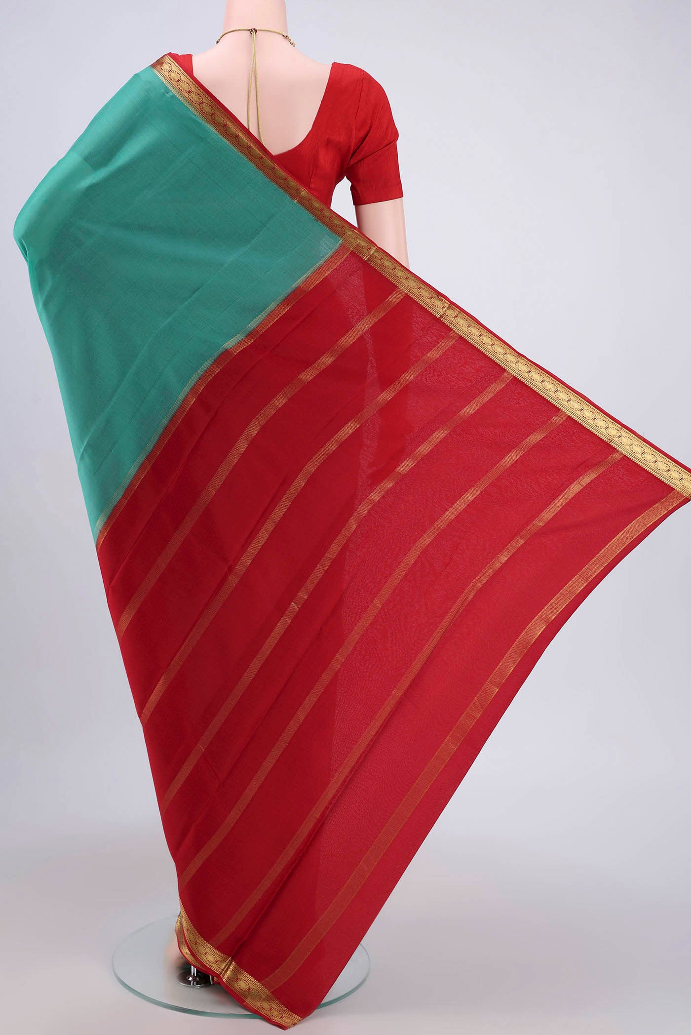 Flat view of Sea Green Mysore Crepe Saree with Plain Body and Zari Border. 