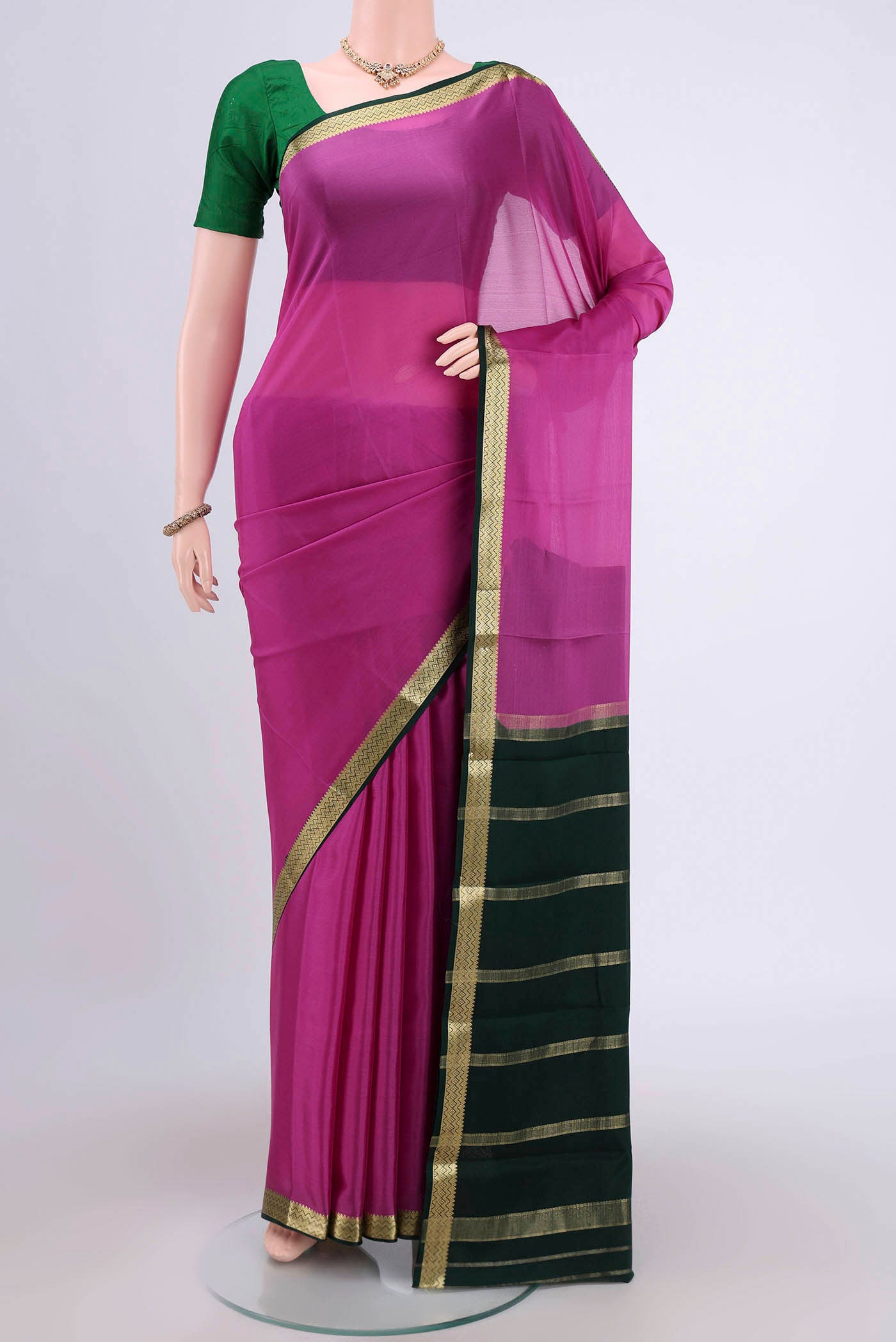Pink Mysore Crepe Saree with Plain Body and Zari Border.  displayed on a mannequin