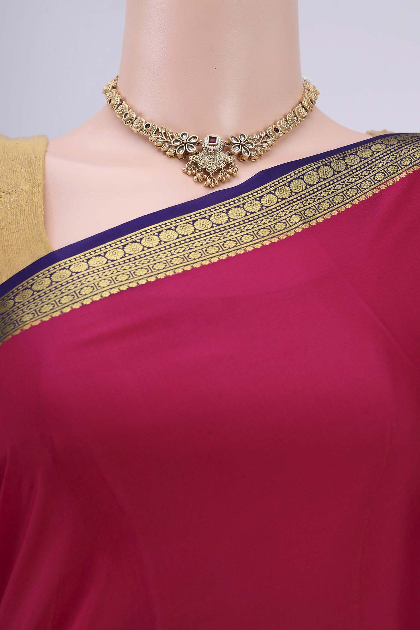Border image of Rani Pink Mysore Crepe Saree with Plain Body and Zari Border. 