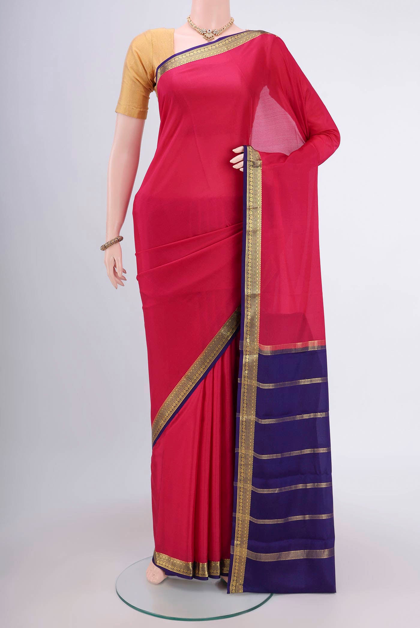 Rani Pink Mysore Crepe Saree with Plain Body and Zari Border.  displayed on a mannequin