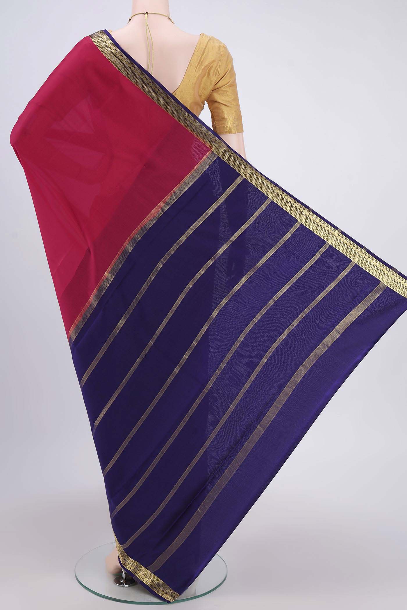 Flat view of Rani Pink Mysore Crepe Saree with Plain Body and Zari Border. 