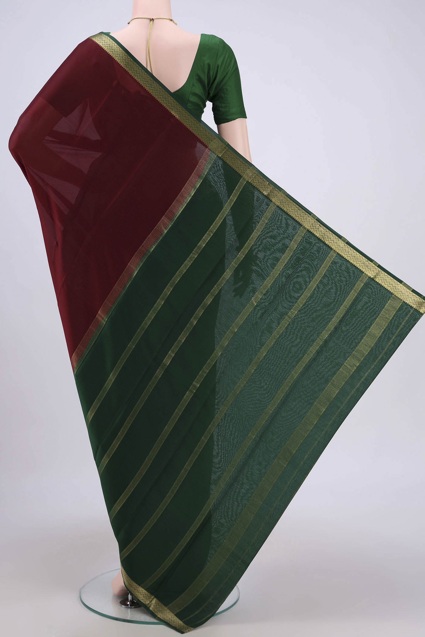Flat view of Maroon Mysore Crepe Saree with Plain Body and Zari Border. 
