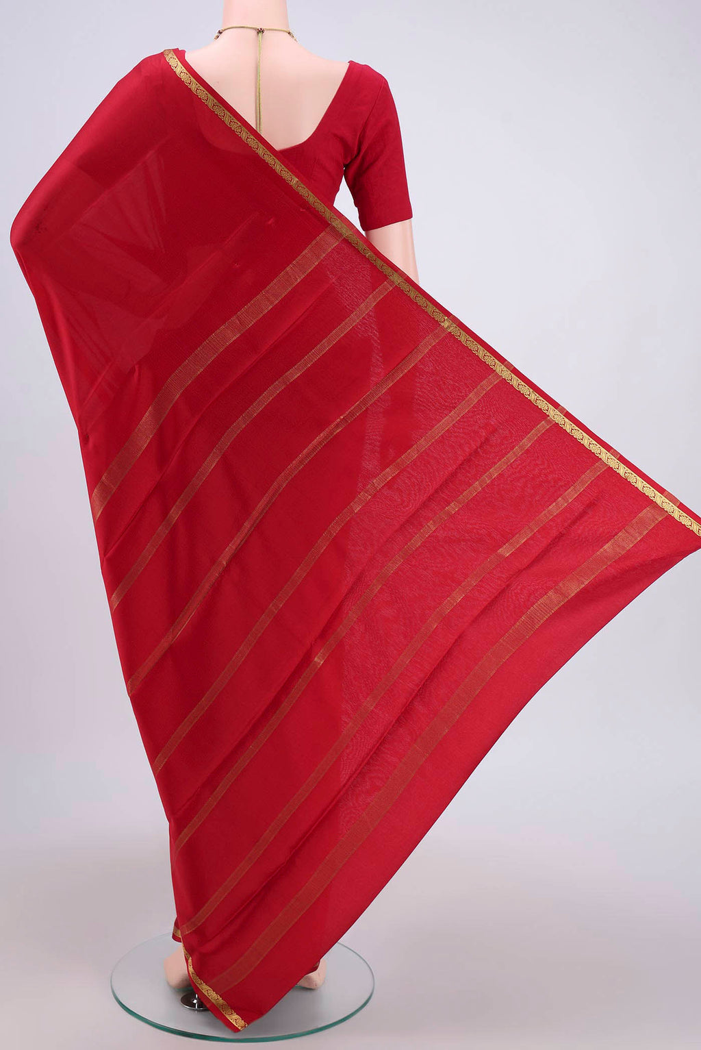 Flat view of Red Mysore Crepe Saree with Plain Body and Zari Border. 