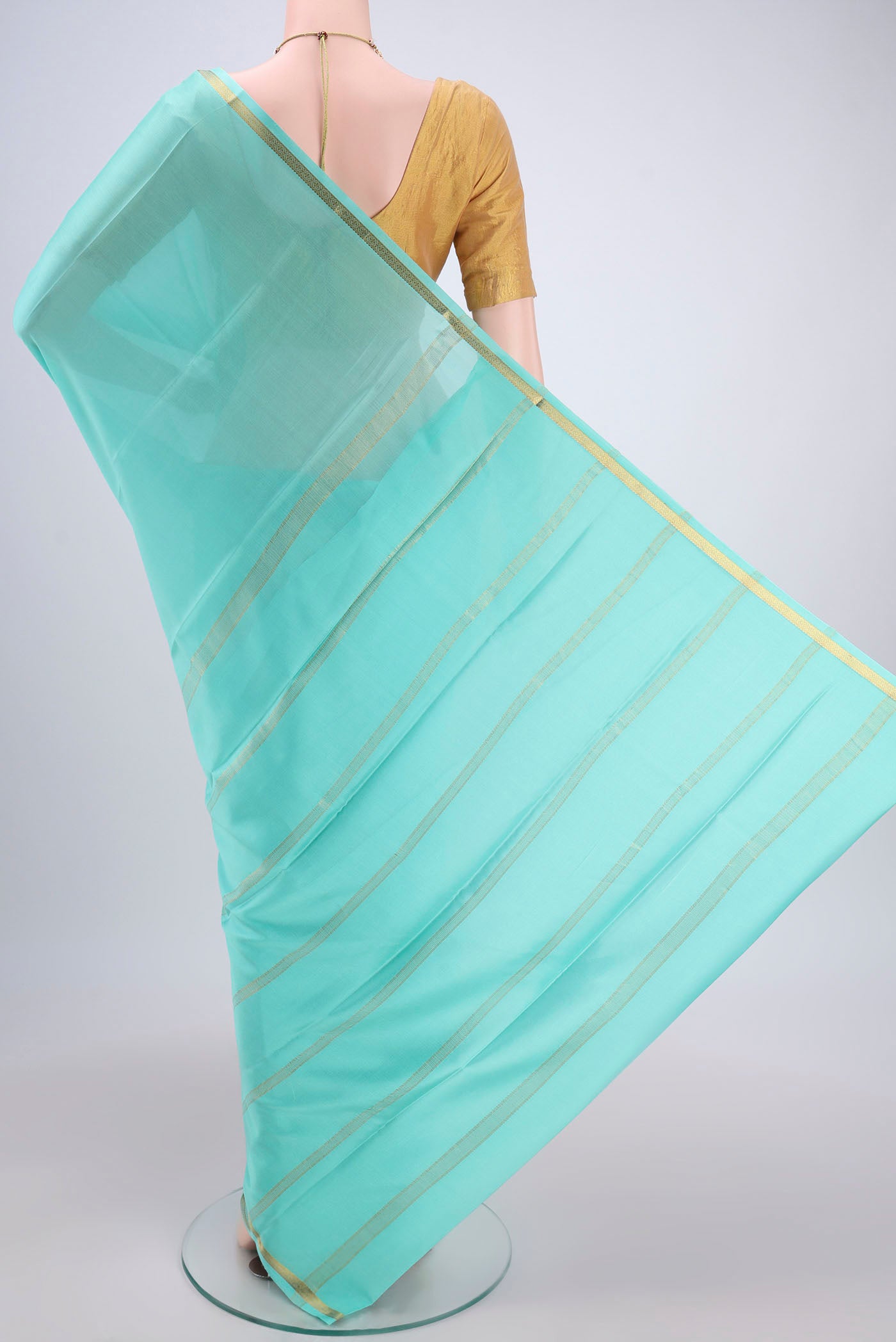 Flat view of Mint Green Mysore Crepe Saree with Plain Body and Zari Border. 