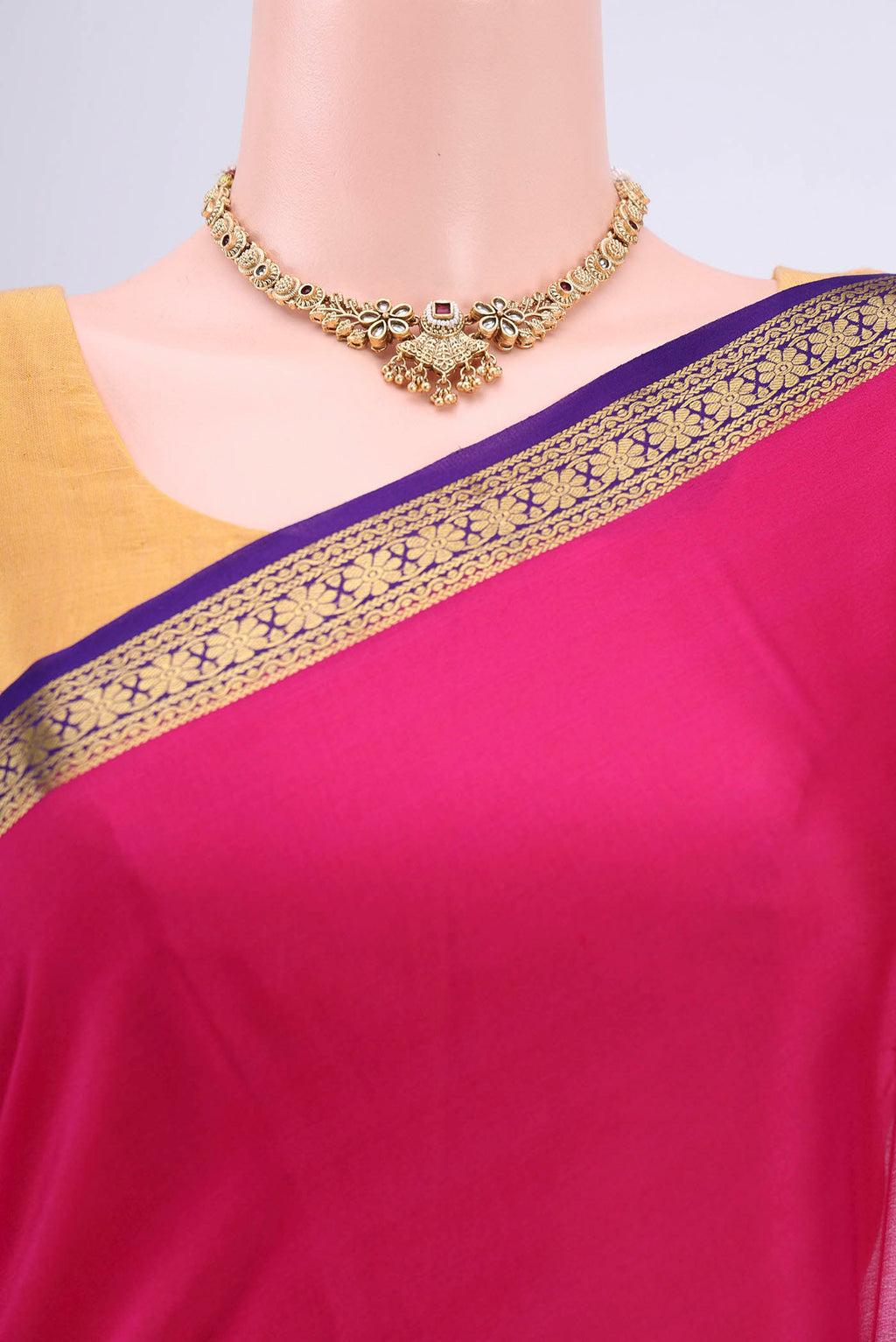 Border image of Rani Pink Mysore Crepe Saree with Plain Body and Zari Border. 