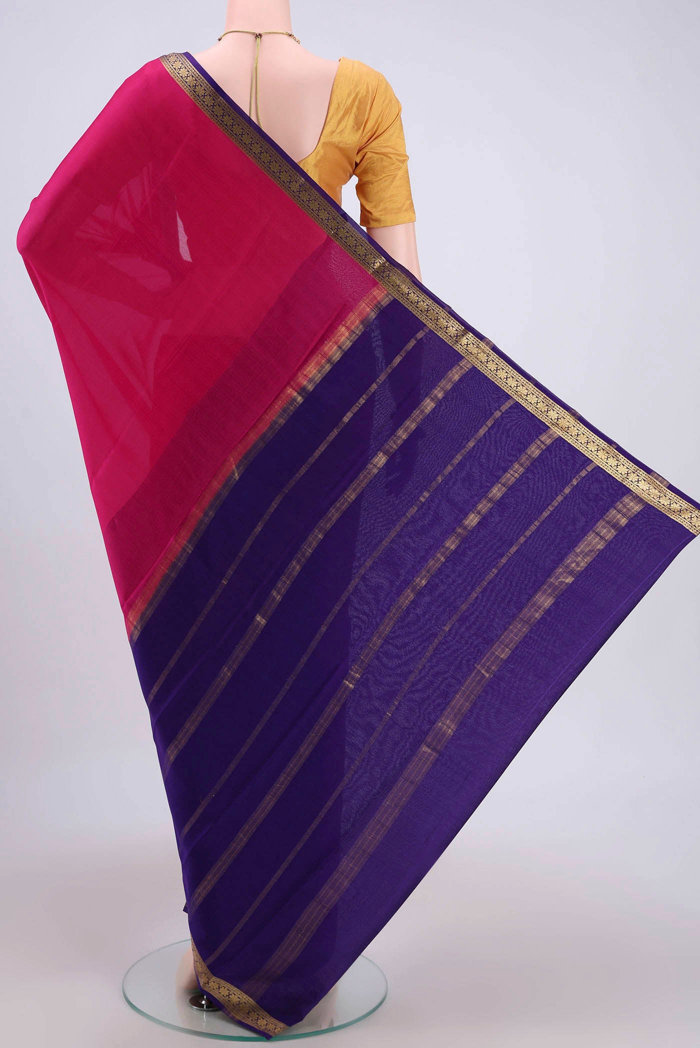 Flat view of Rani Pink Mysore Crepe Saree with Plain Body and Zari Border. 