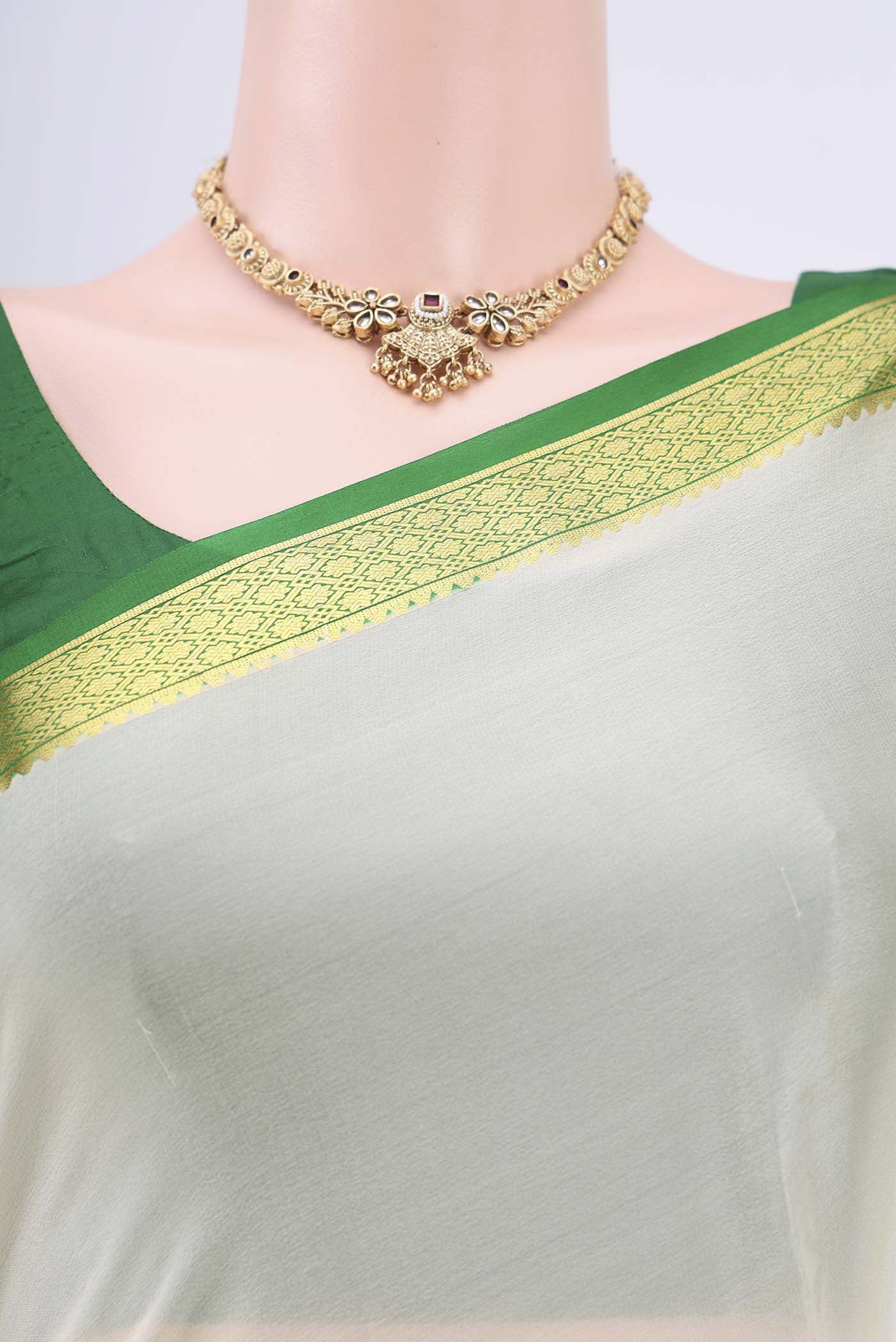 Border image of Off White Mysore Crepe Saree with Plain Body and Zari Border. 