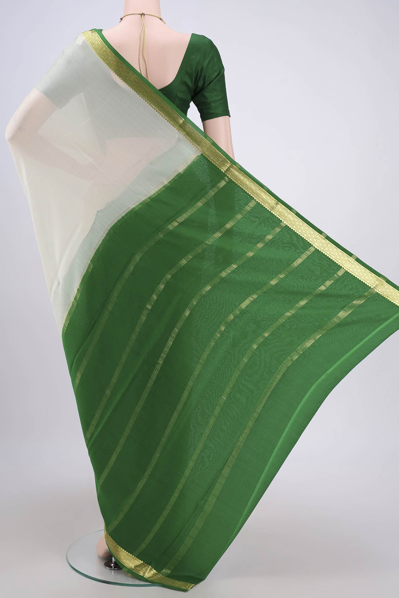 Flat view of Off White Mysore Crepe Saree with Plain Body and Zari Border. 