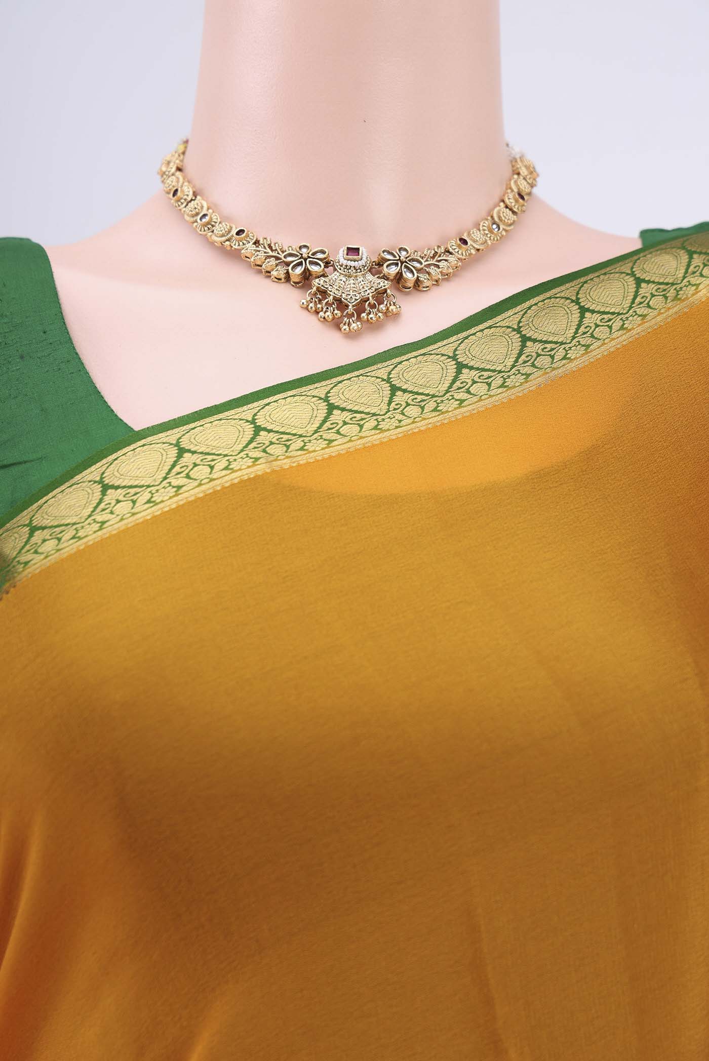Border image of Mustard Mysore Crepe Saree with Plain Body and Zari Border. 