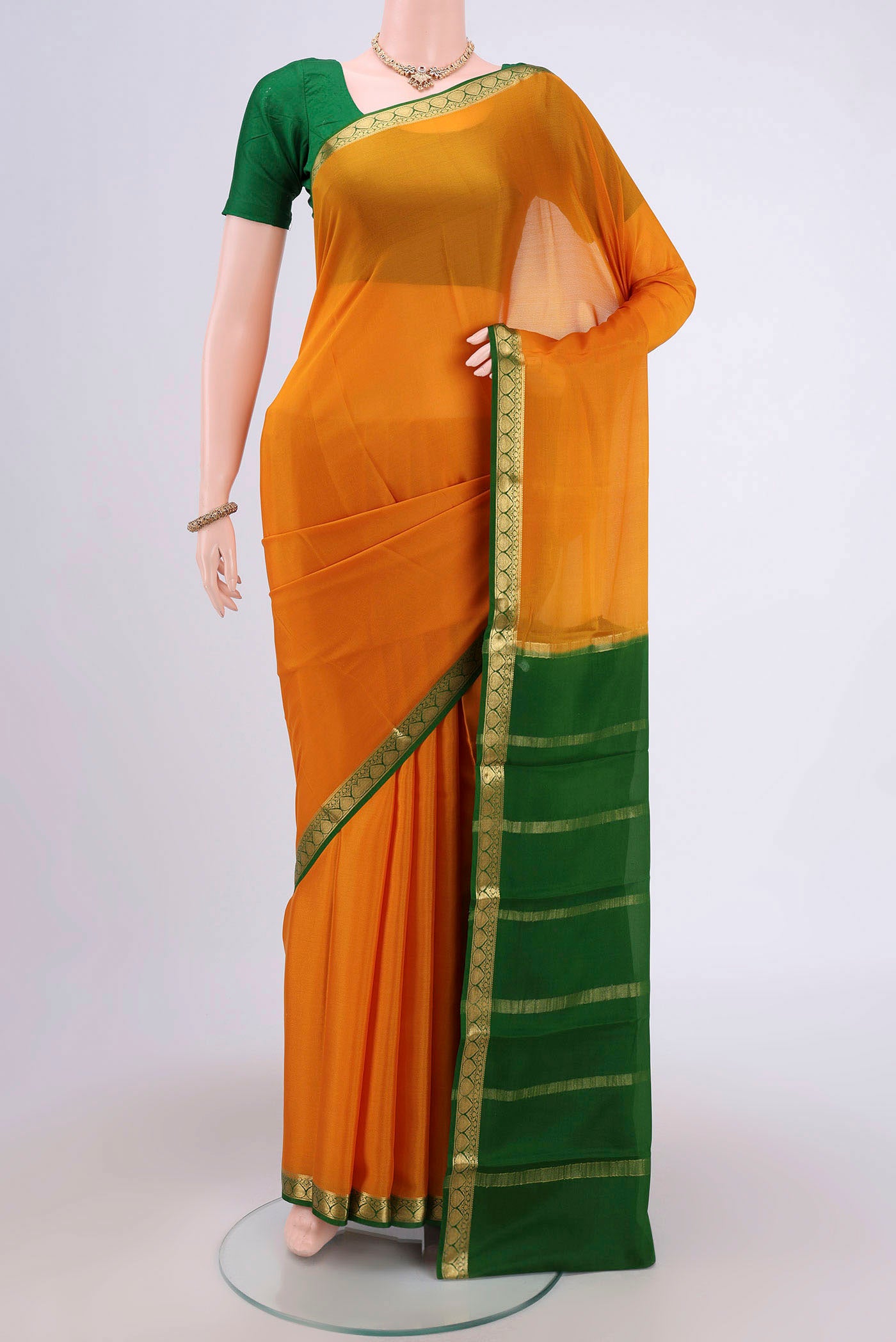 Mustard Mysore Crepe Saree with Plain Body and Zari Border.  displayed on a mannequin