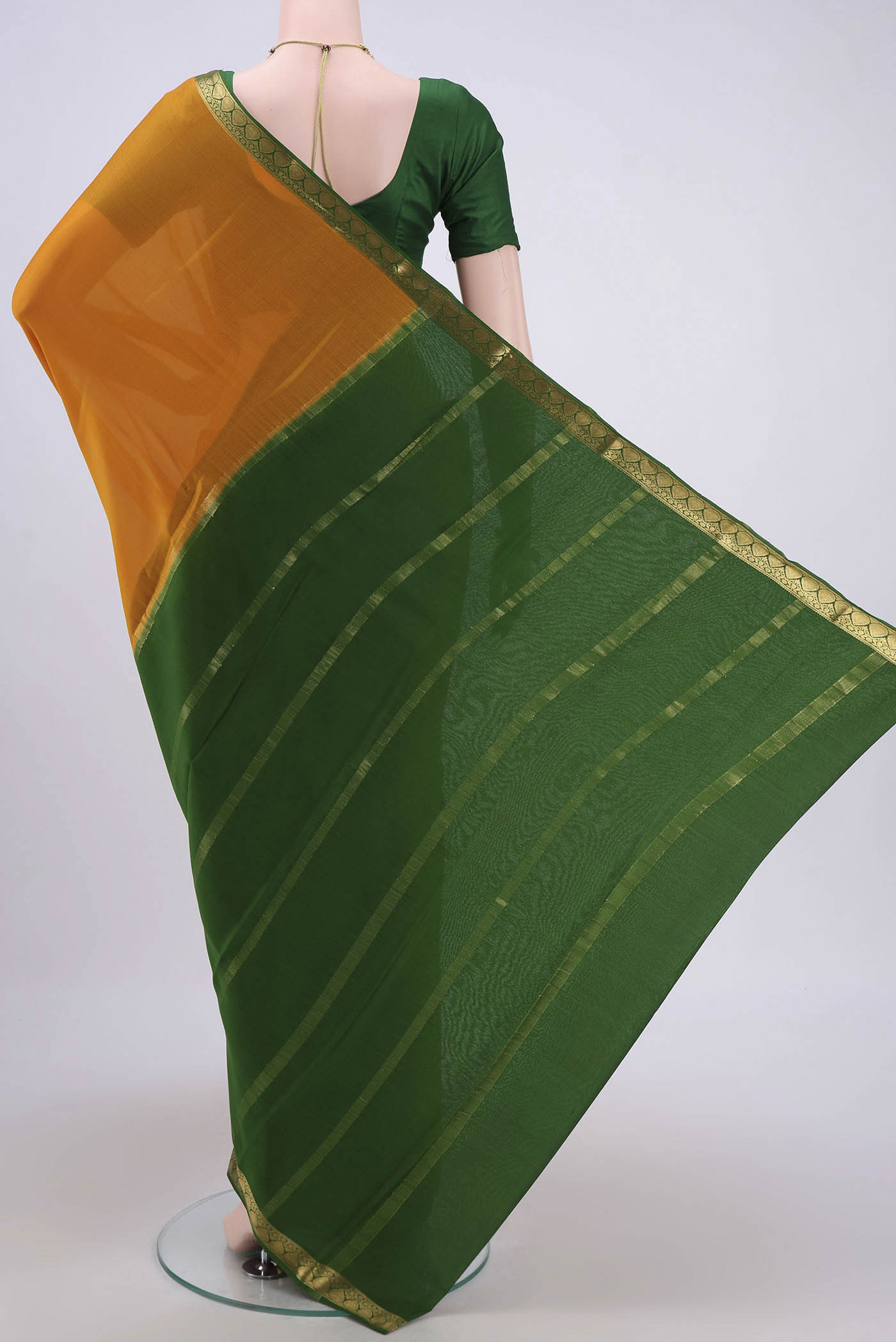 Flat view of Mustard Mysore Crepe Saree with Plain Body and Zari Border. 