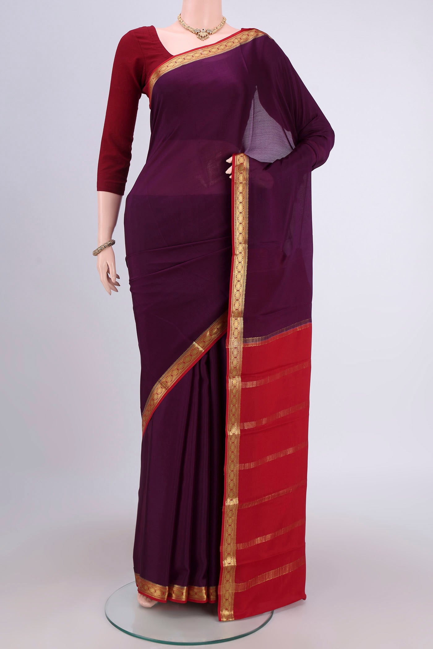 Pista Green Mysore Crepe Saree with Plain Body and Zari Border.  displayed on a mannequin