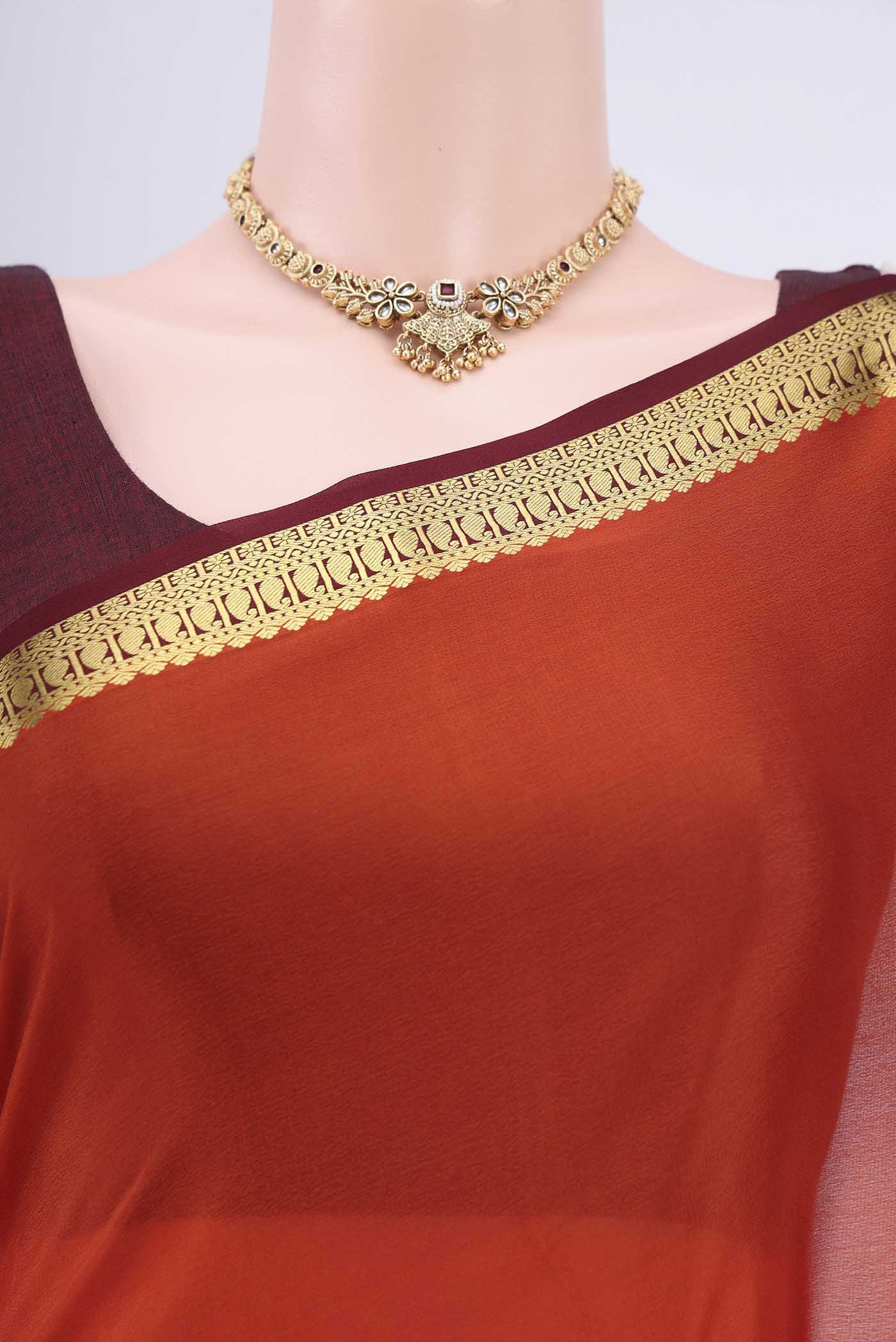 Border image of Rust Mysore Crepe Saree with Plain Body and Zari Border. 