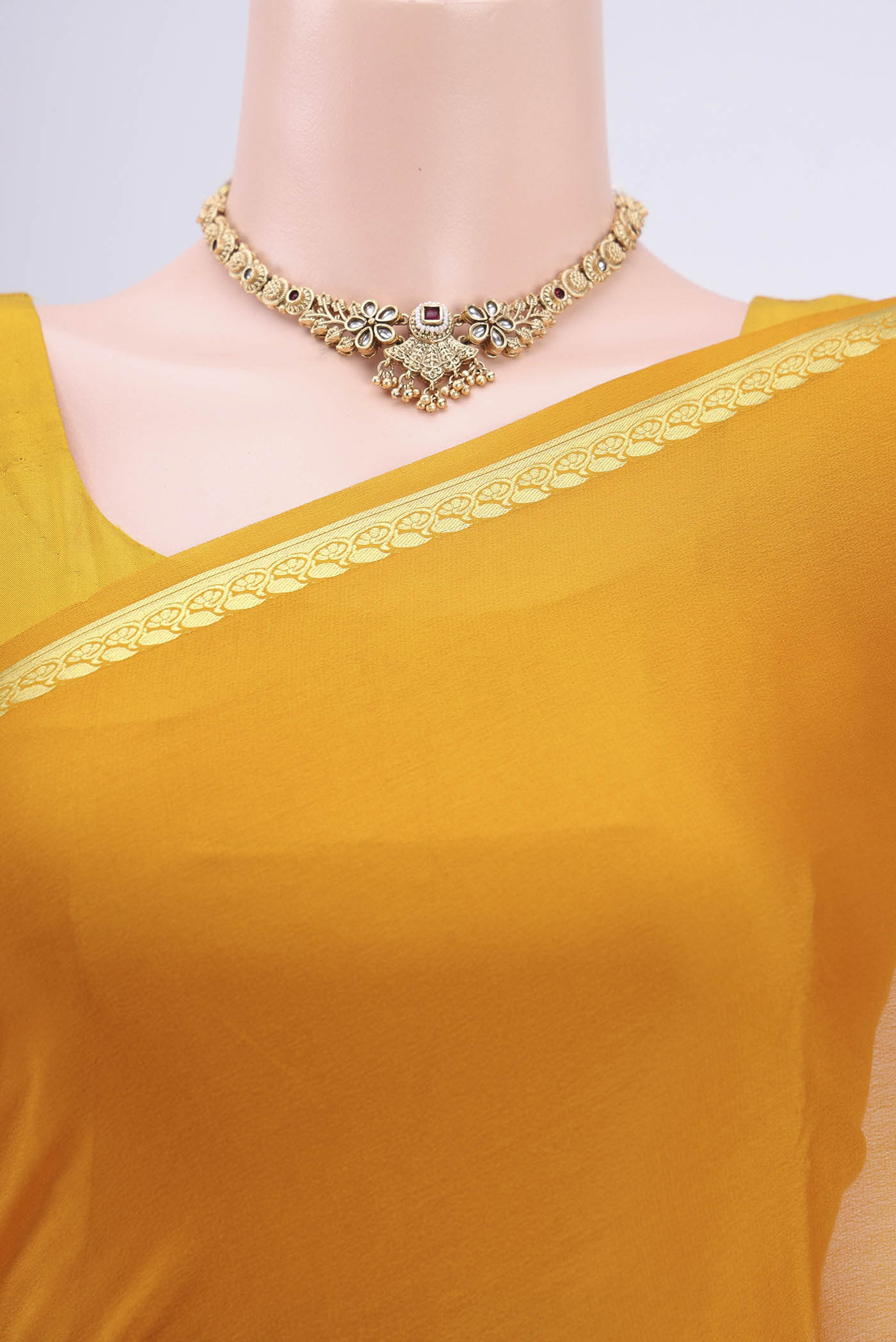 Border image of Mustard Mysore Crepe Saree with Plain Body and Zari Border. 