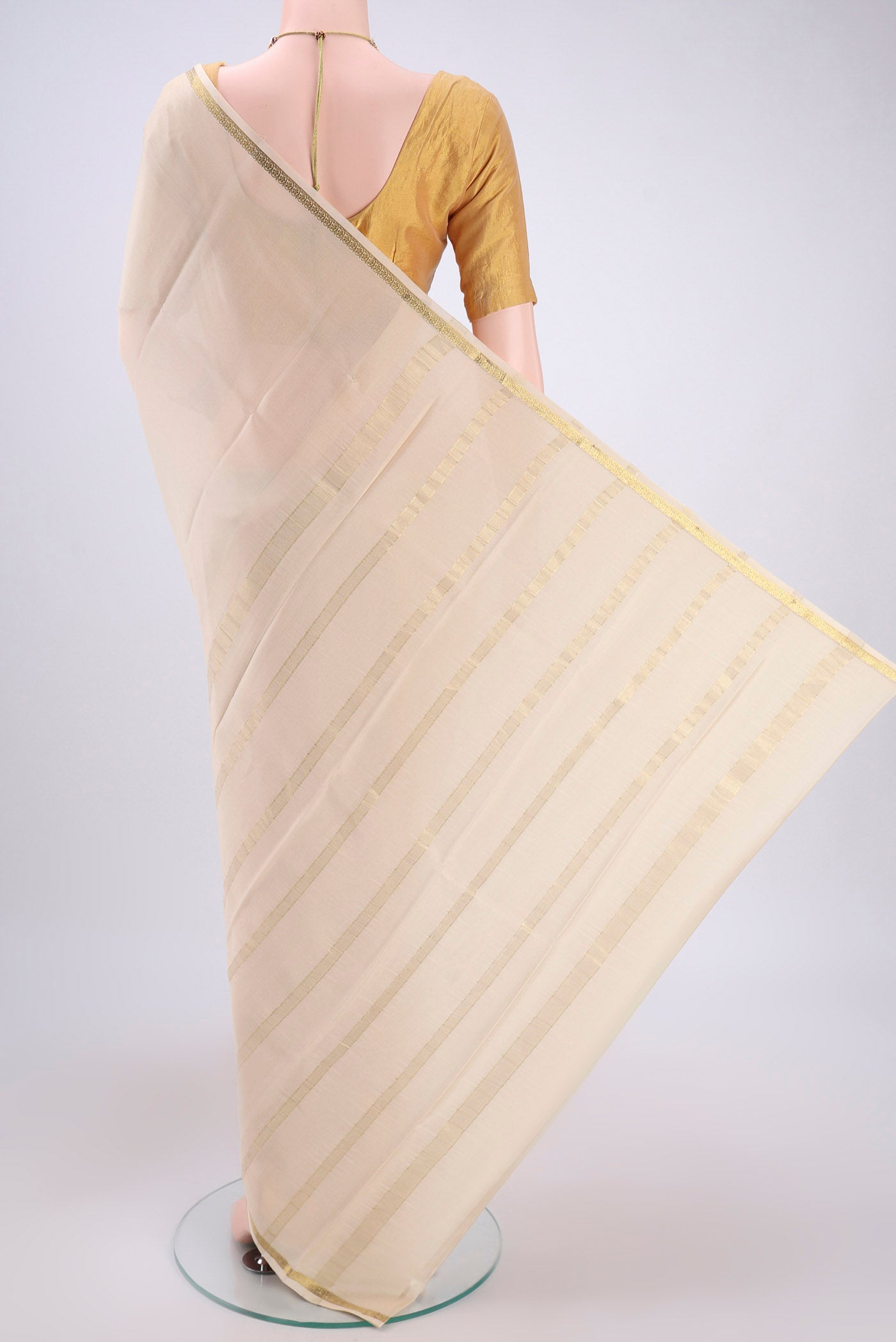 Flat view of Cream Mysore Crepe Saree with Plain Body and Zari Border. 