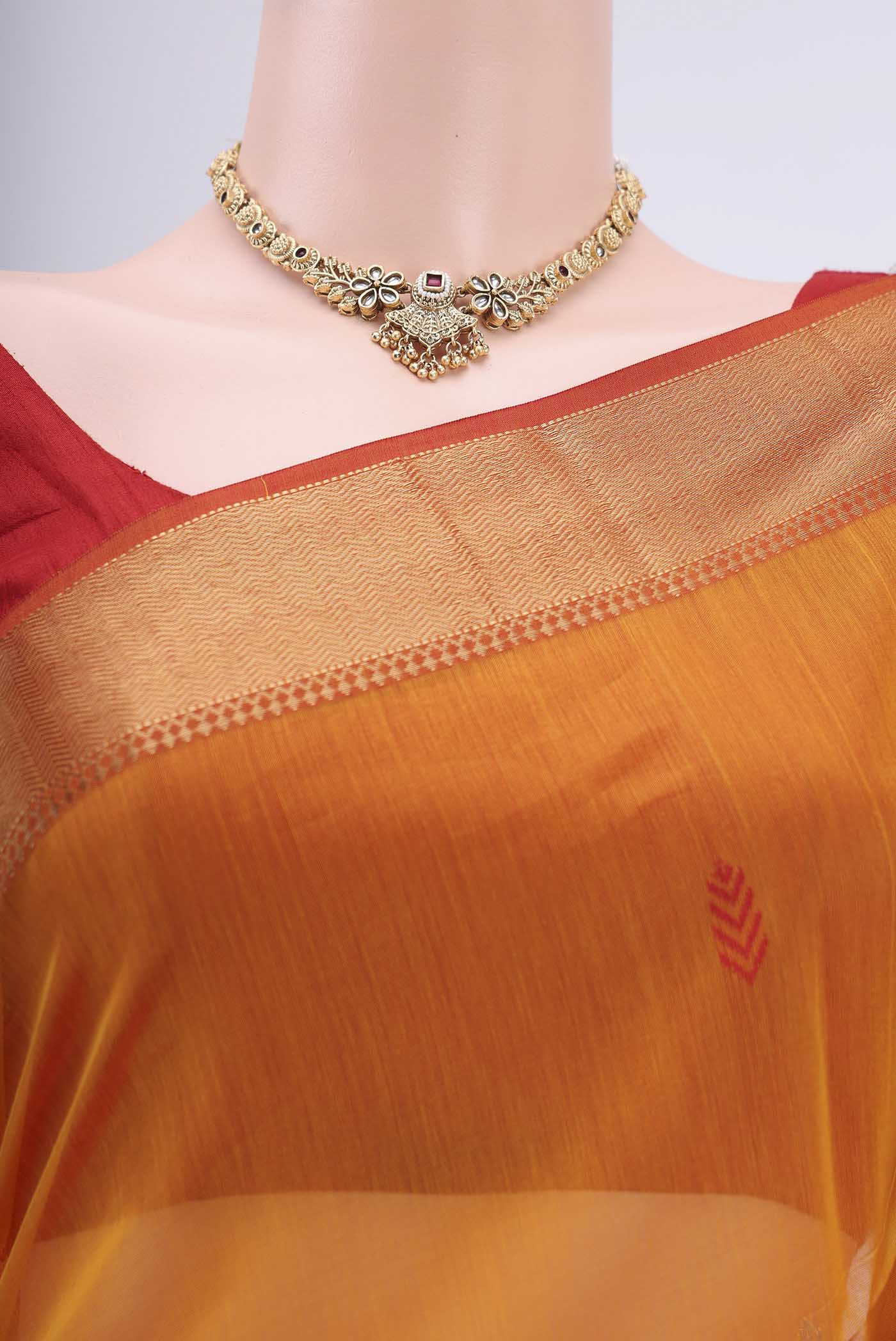 Border image of Brick Orange Maheshwari Silk Cotton Saree with Stripes on the body and Zari Border. 