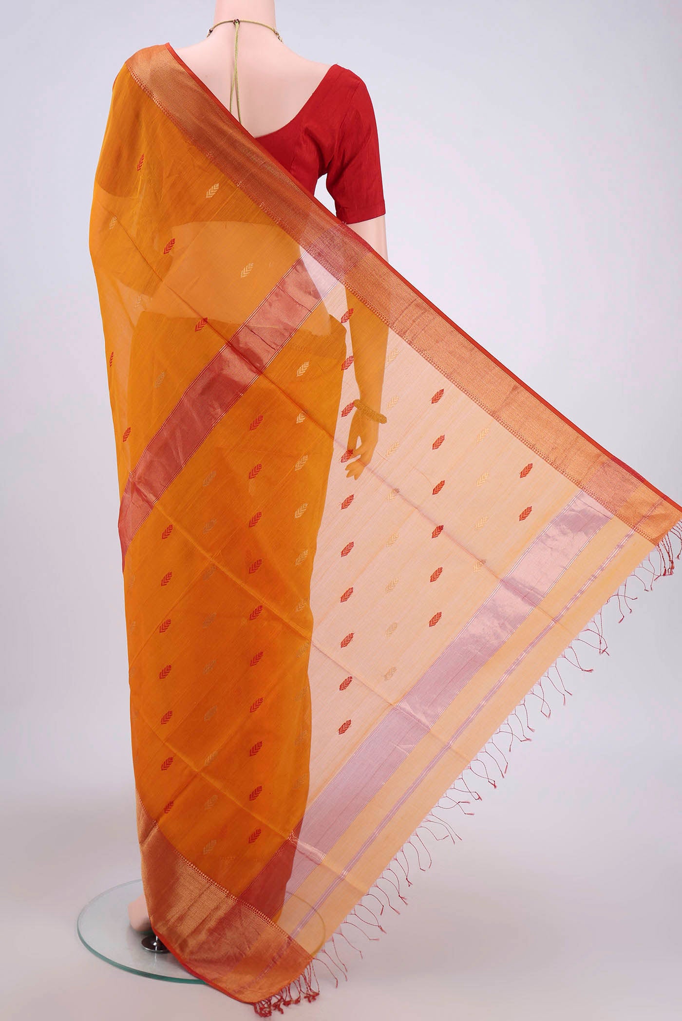 Flat view of Brick Orange Maheshwari Silk Cotton Saree with Stripes on the body and Zari Border. 