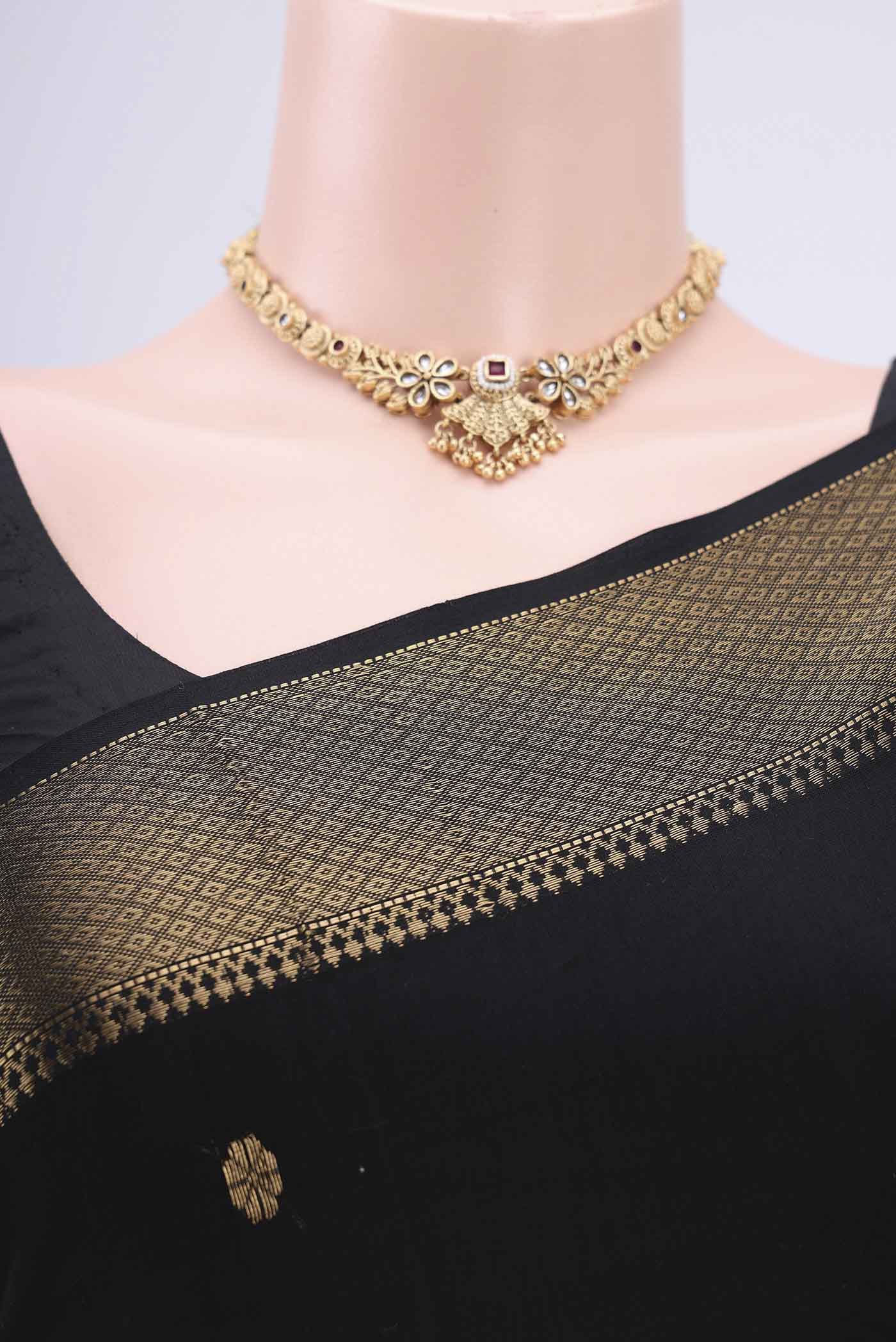 Border image of Black Maheshwari Silk Cotton Saree with Stripes on the body and Zari Border. 