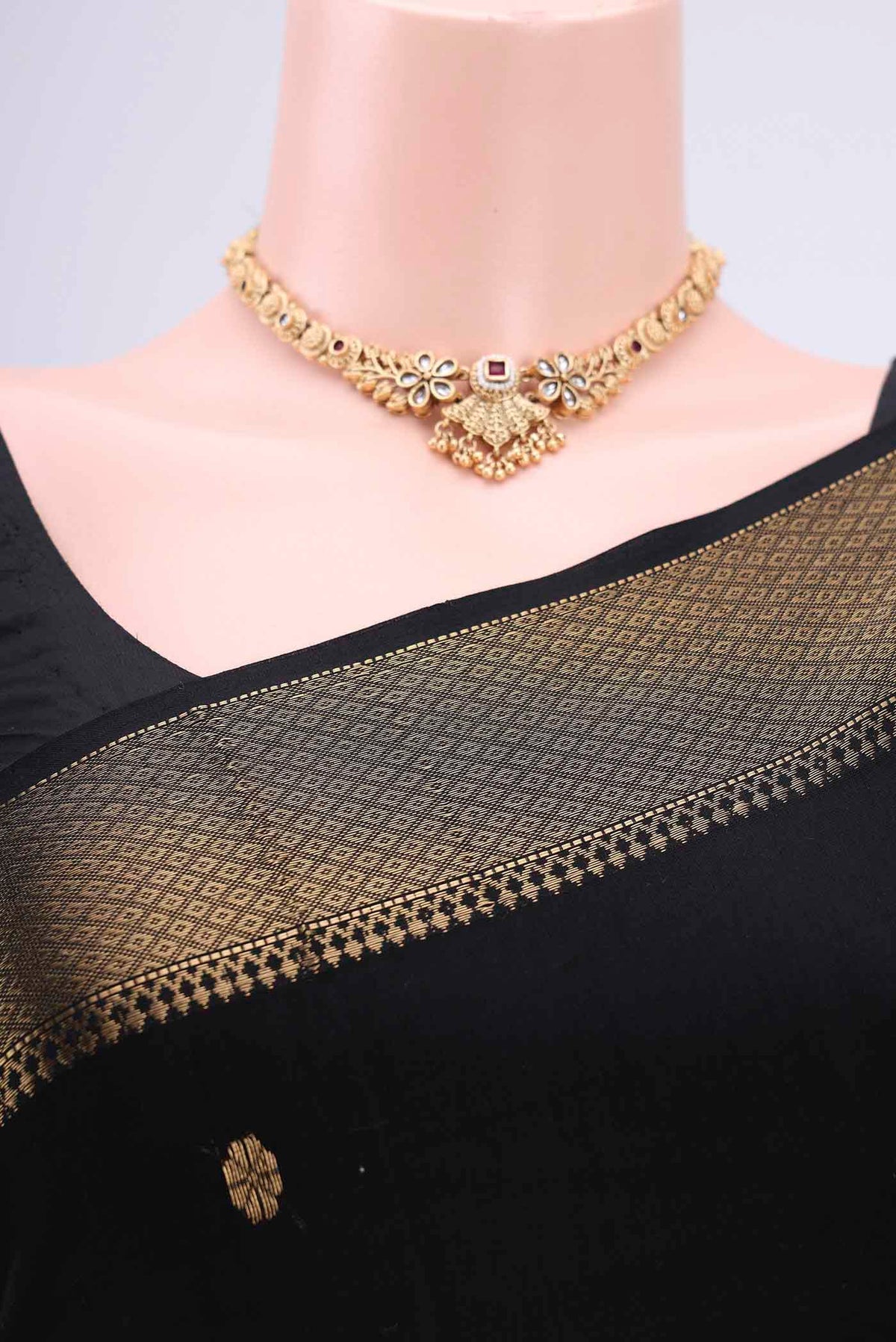 Border image of Black Maheshwari Silk Cotton Saree with Stripes on the body and Zari Border. 