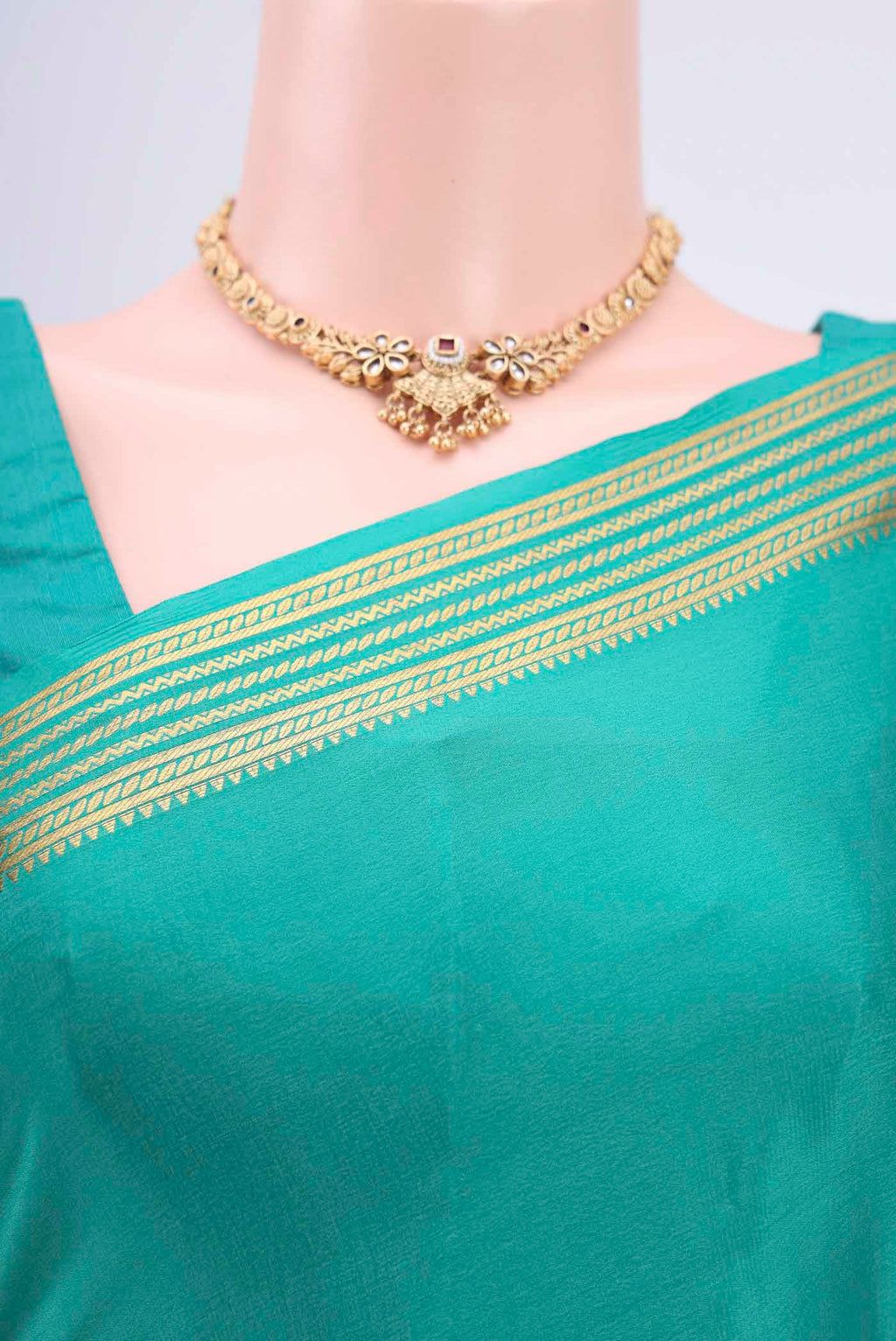 Border image of Sea Green Mysore Crepe Saree with Plain Body and Zari Border. 
