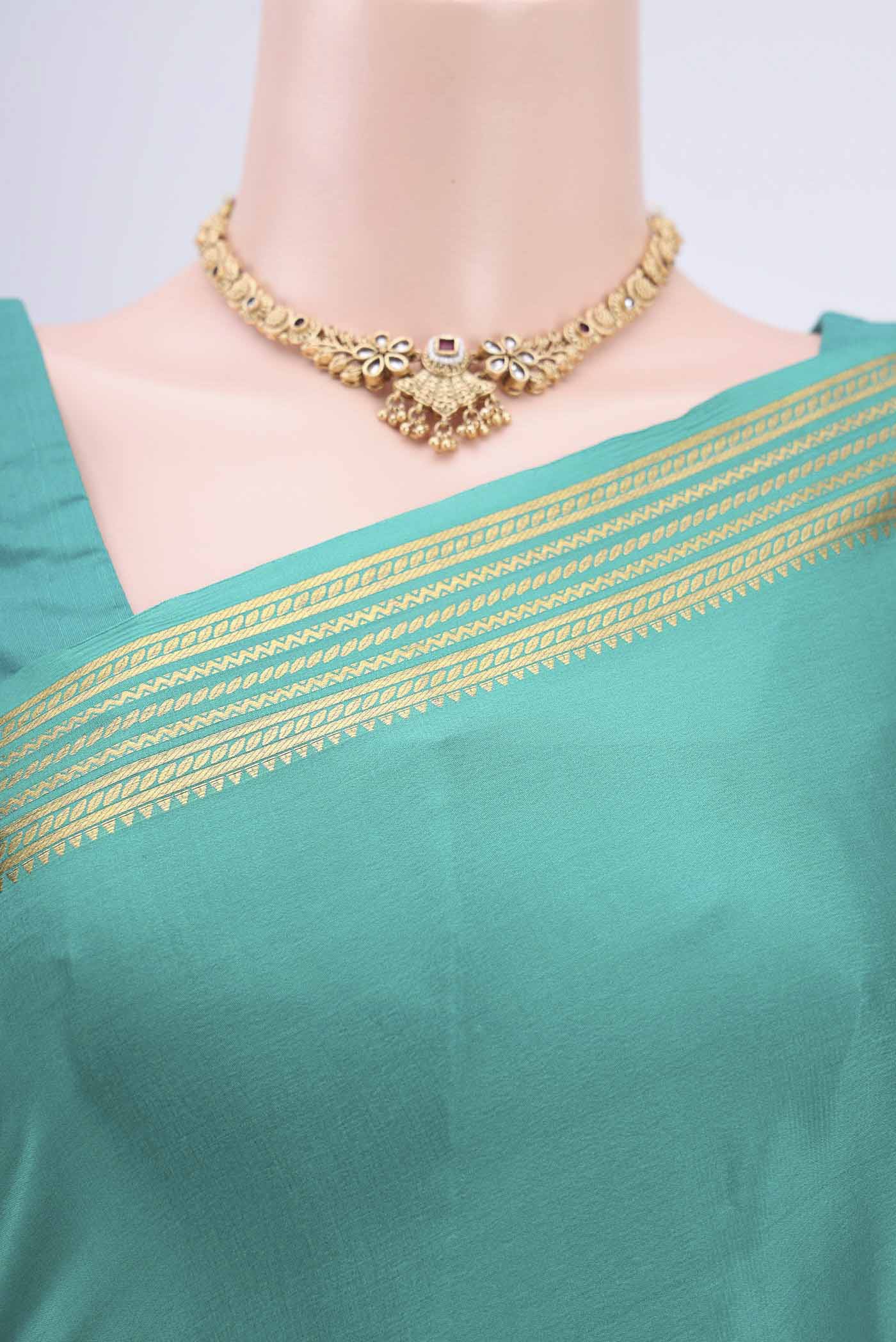 Border image of Sea Green Mysore Crepe Saree with Plain Body and Zari Border. 